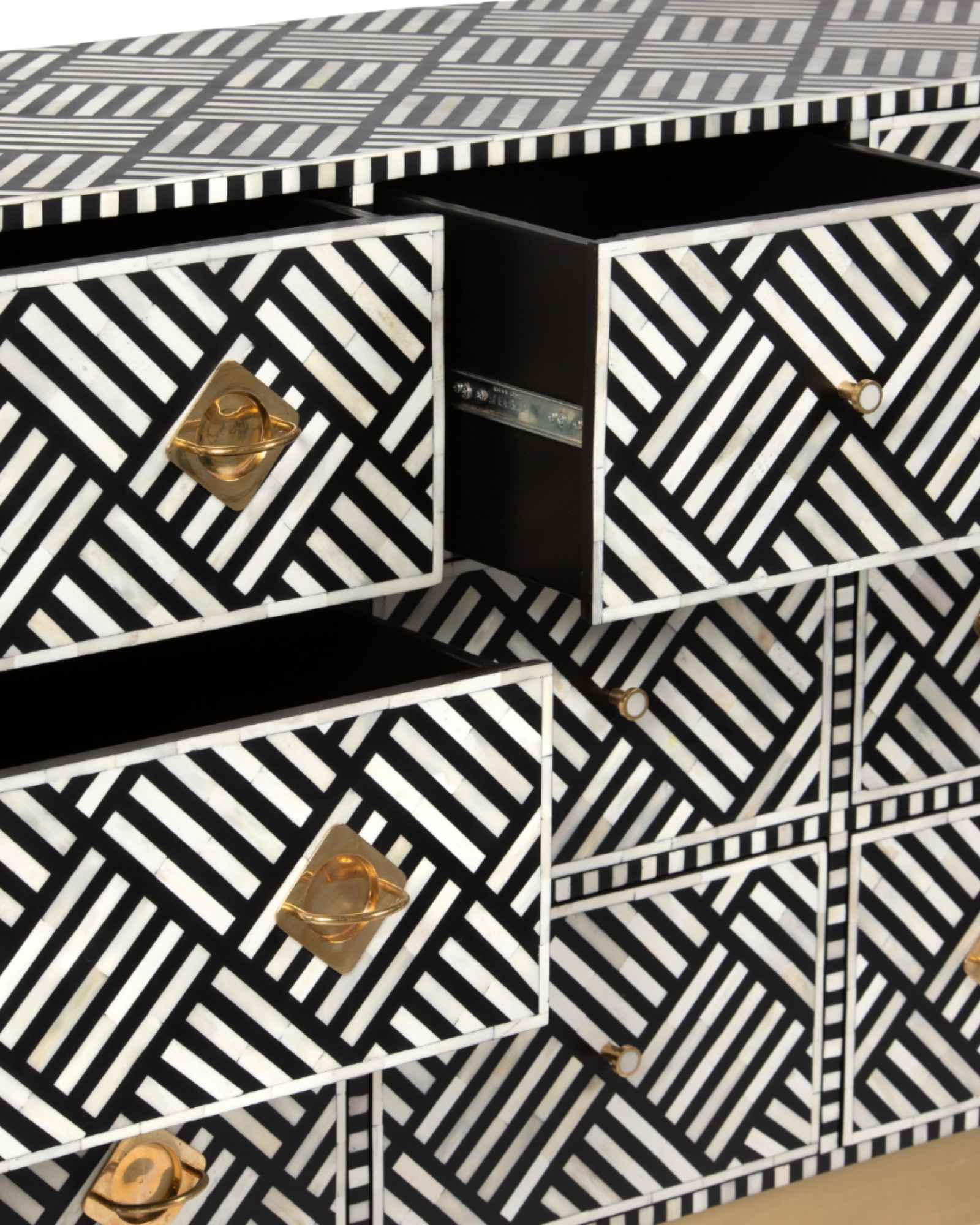 Luxury black and white bone inlay chest of drawers with brass accents and geometric design, handcrafted for statement interiors.