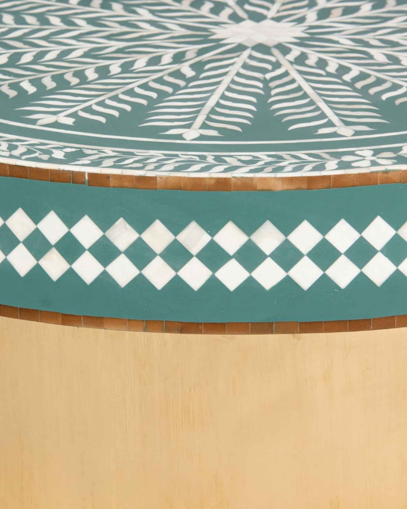 Green floral patterned bone inlay coffee table with diamond border detail and brushed gold cylindrical base by Tabeer Homes.