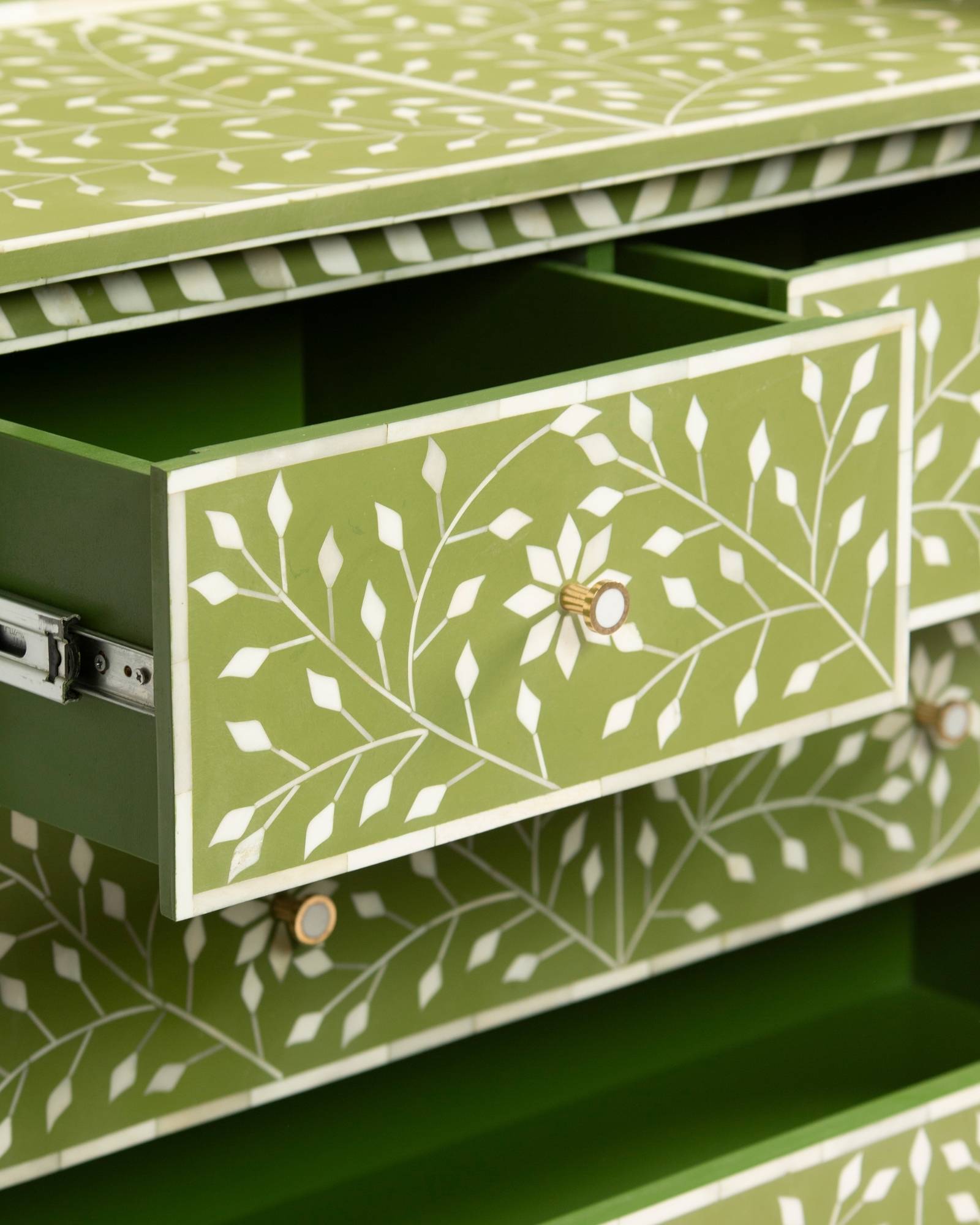 Bone inlay chest of drawers featuring intricate floral vine pattern in green and white, handcrafted furniture piece.