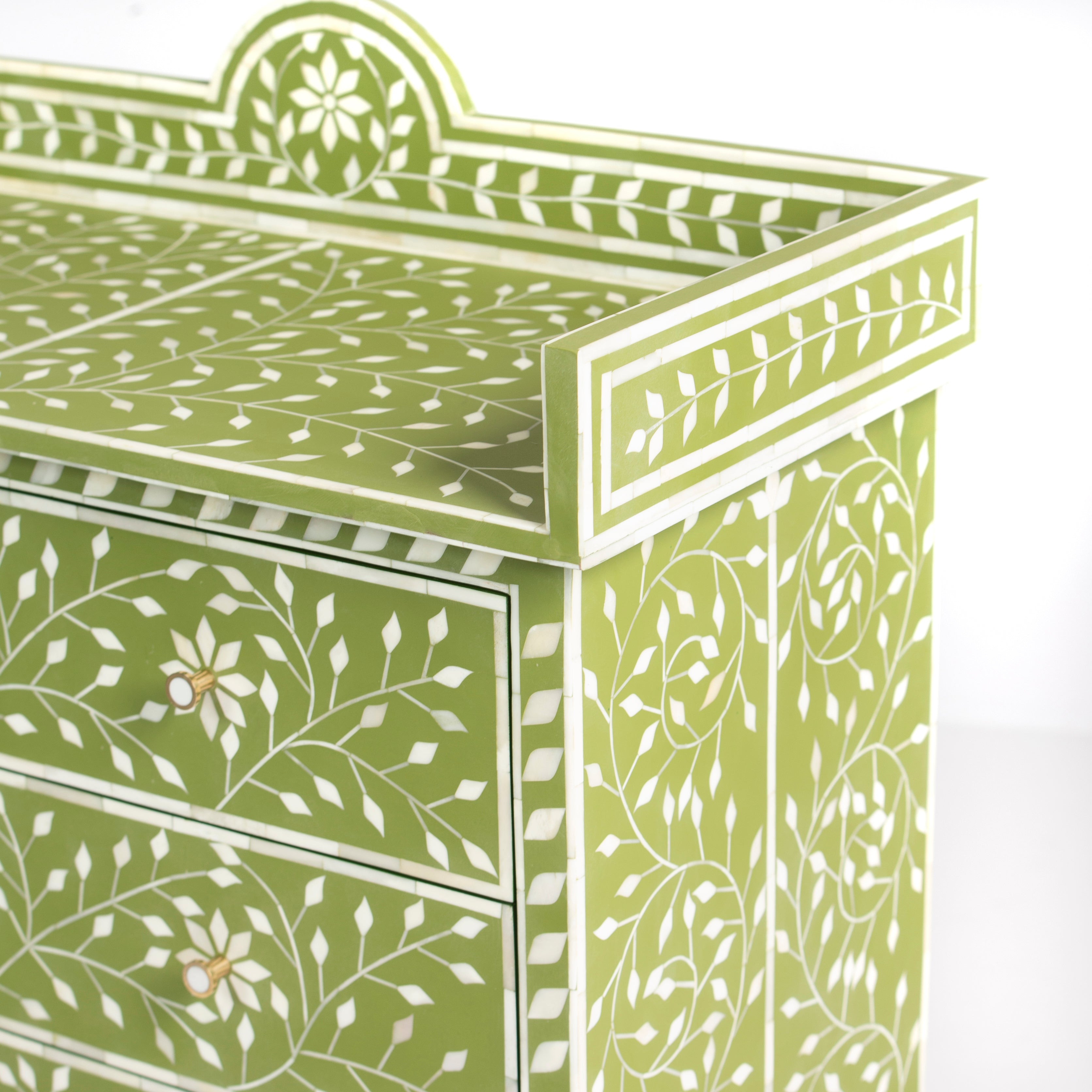 Bone inlay chest of drawers featuring intricate floral vine pattern in green and white, handcrafted furniture piece