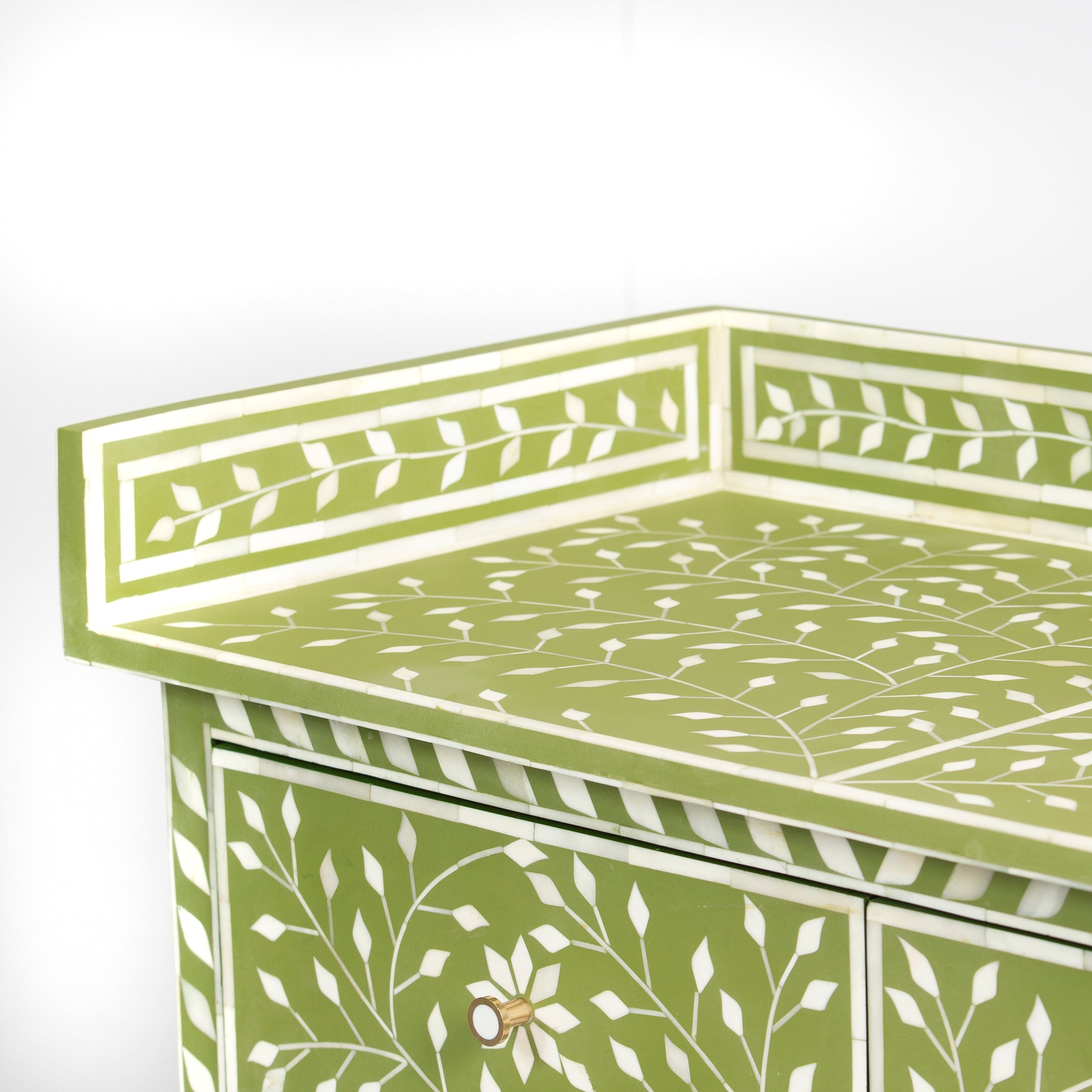 Bone inlay chest of drawers featuring intricate floral vine pattern in green and white, handcrafted furniture piece