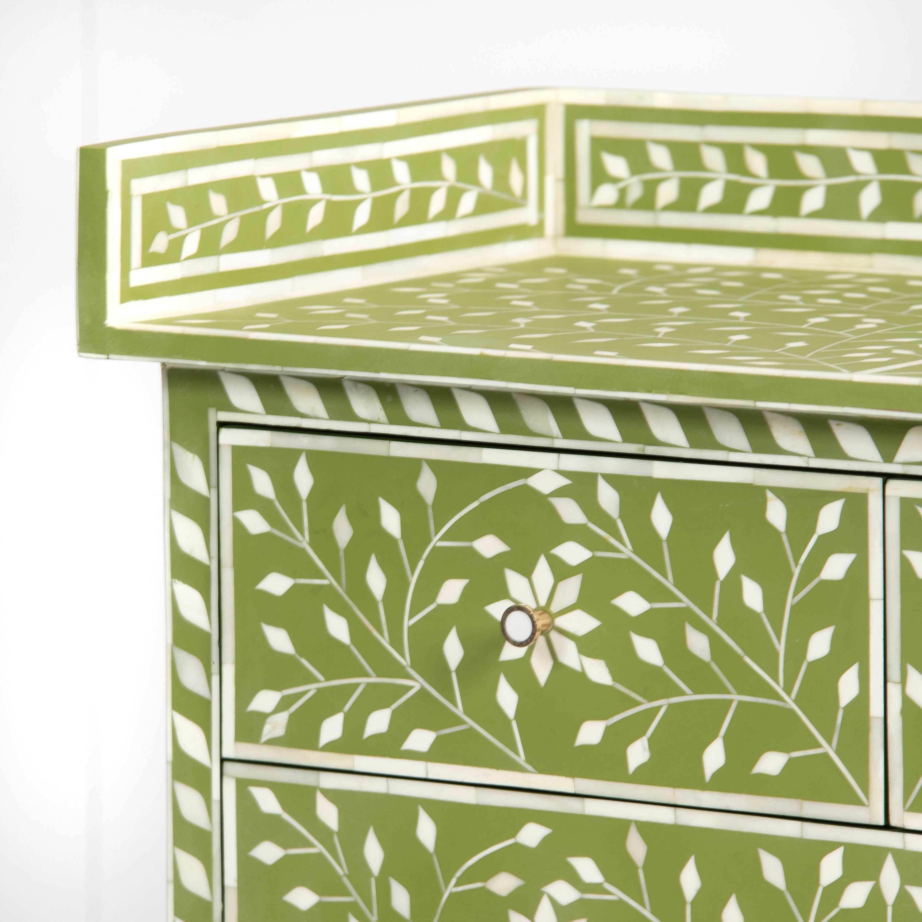 Bone inlay chest of drawers featuring intricate floral vine pattern in green and white, handcrafted furniture piece