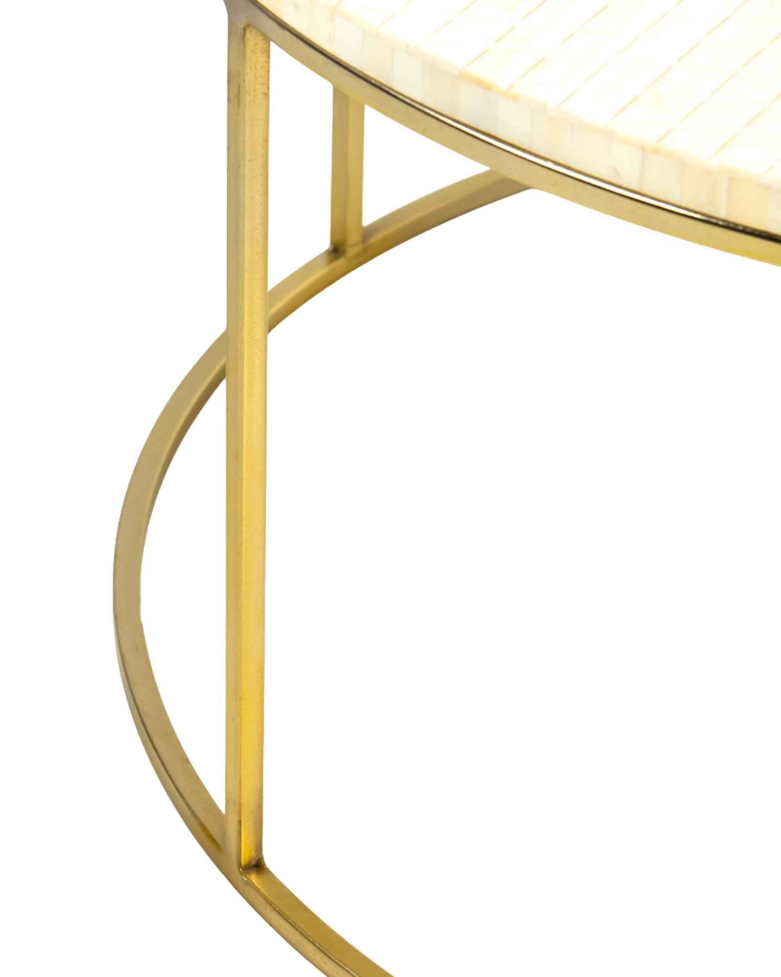 Ivory bone carved coffee table with linear textured design and brushed gold circular metal base by Tabeer Homes.