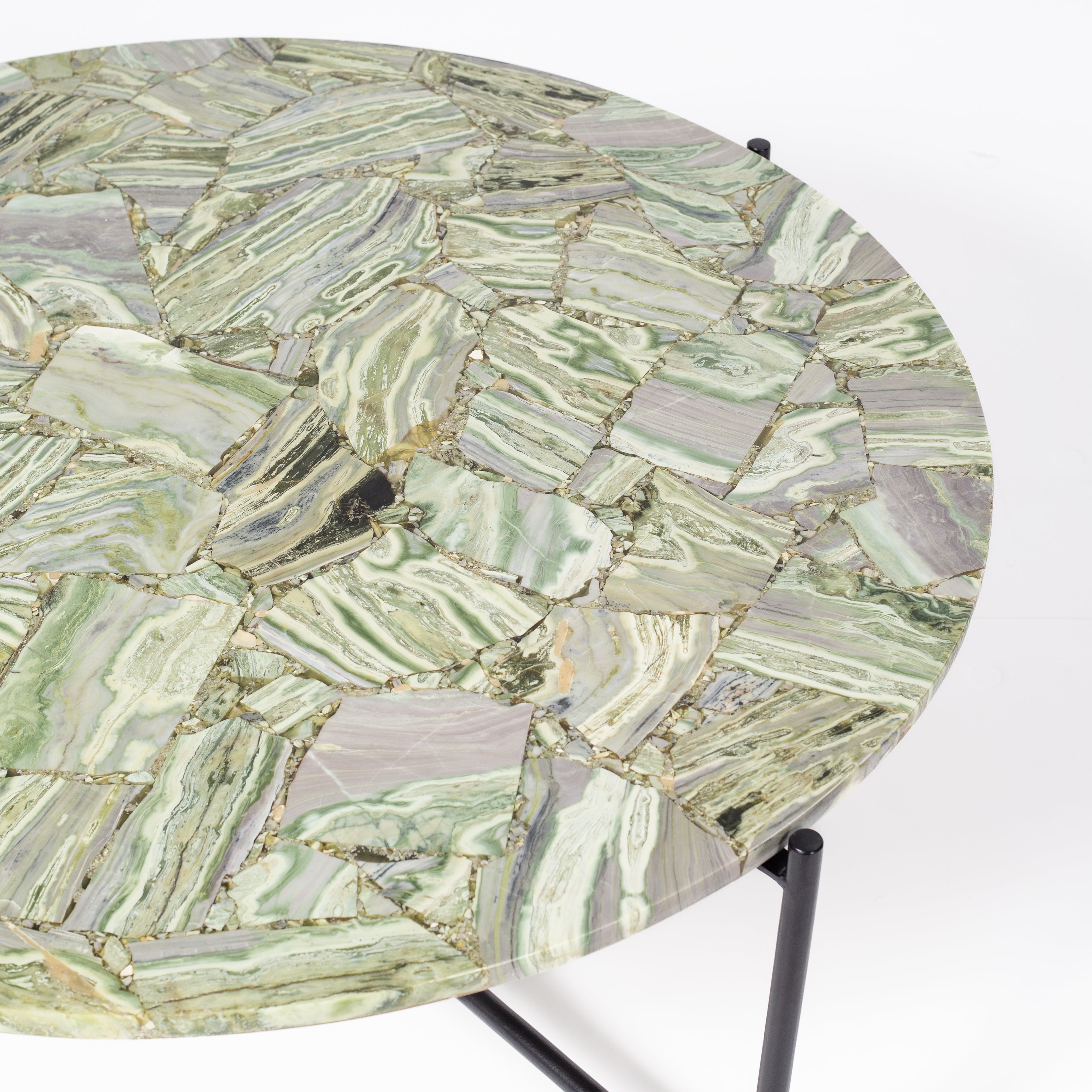 Handcrafted agate coffee table with round stone top and black metal base, artisan-made heritage piece.