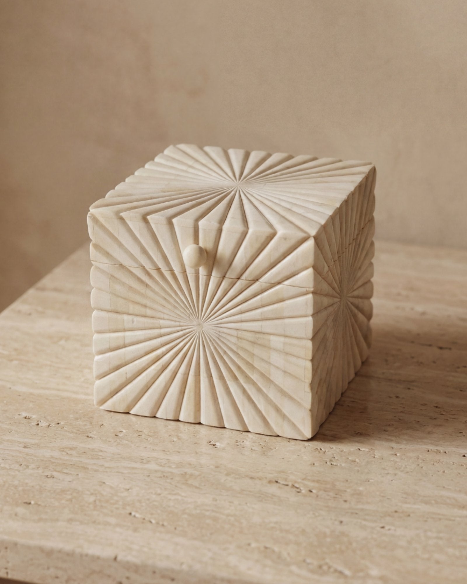 Hand carved bone decorative box with radial geometric pattern, handcrafted storage box in natural ivory finish.