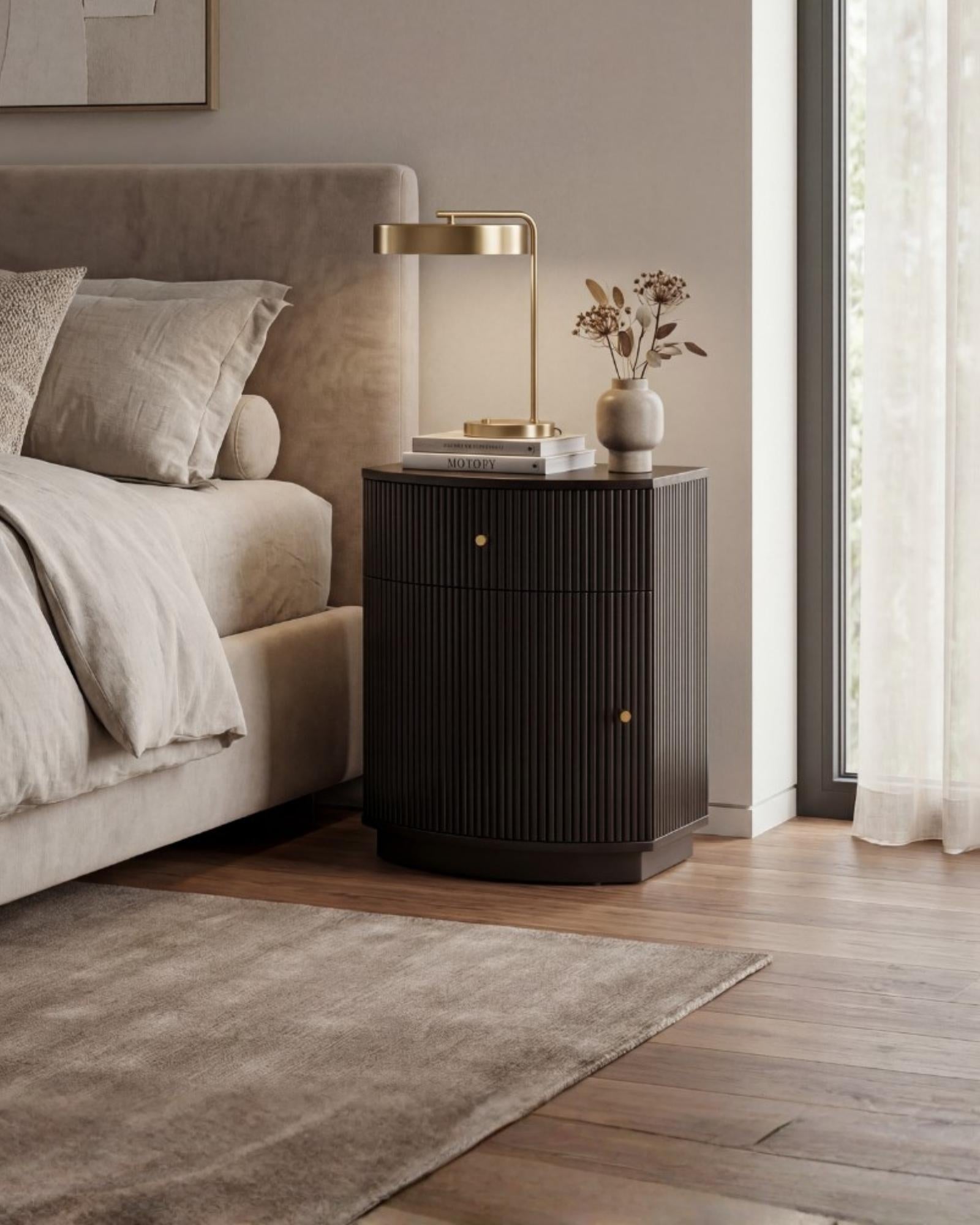 Wooden side drawer featuring fluted texture in black with brass accents, handcrafted furniture piece.