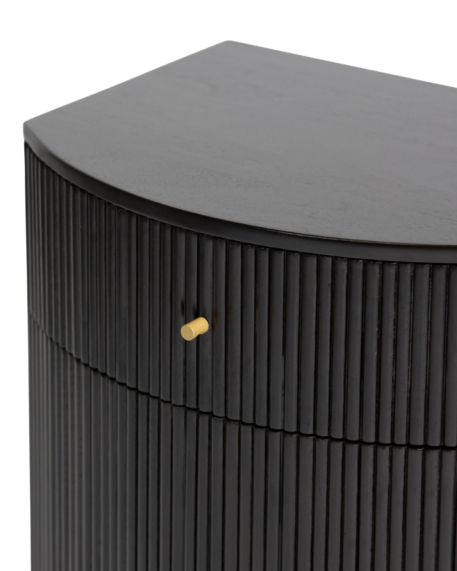 Wooden side drawer featuring fluted texture in black with brass accents, handcrafted furniture piece.