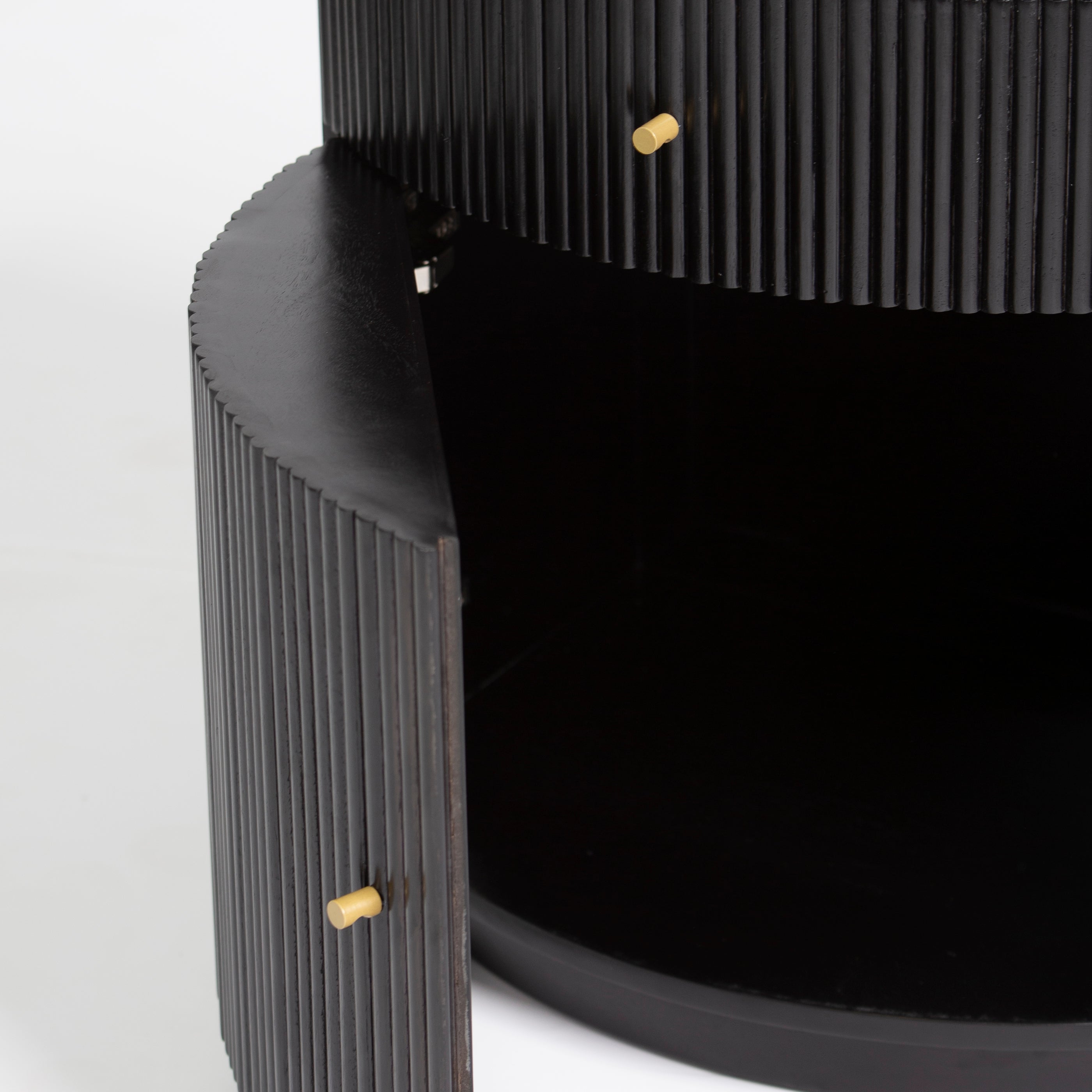 Wooden side drawer featuring fluted texture in black with brass accents, handcrafted furniture piece