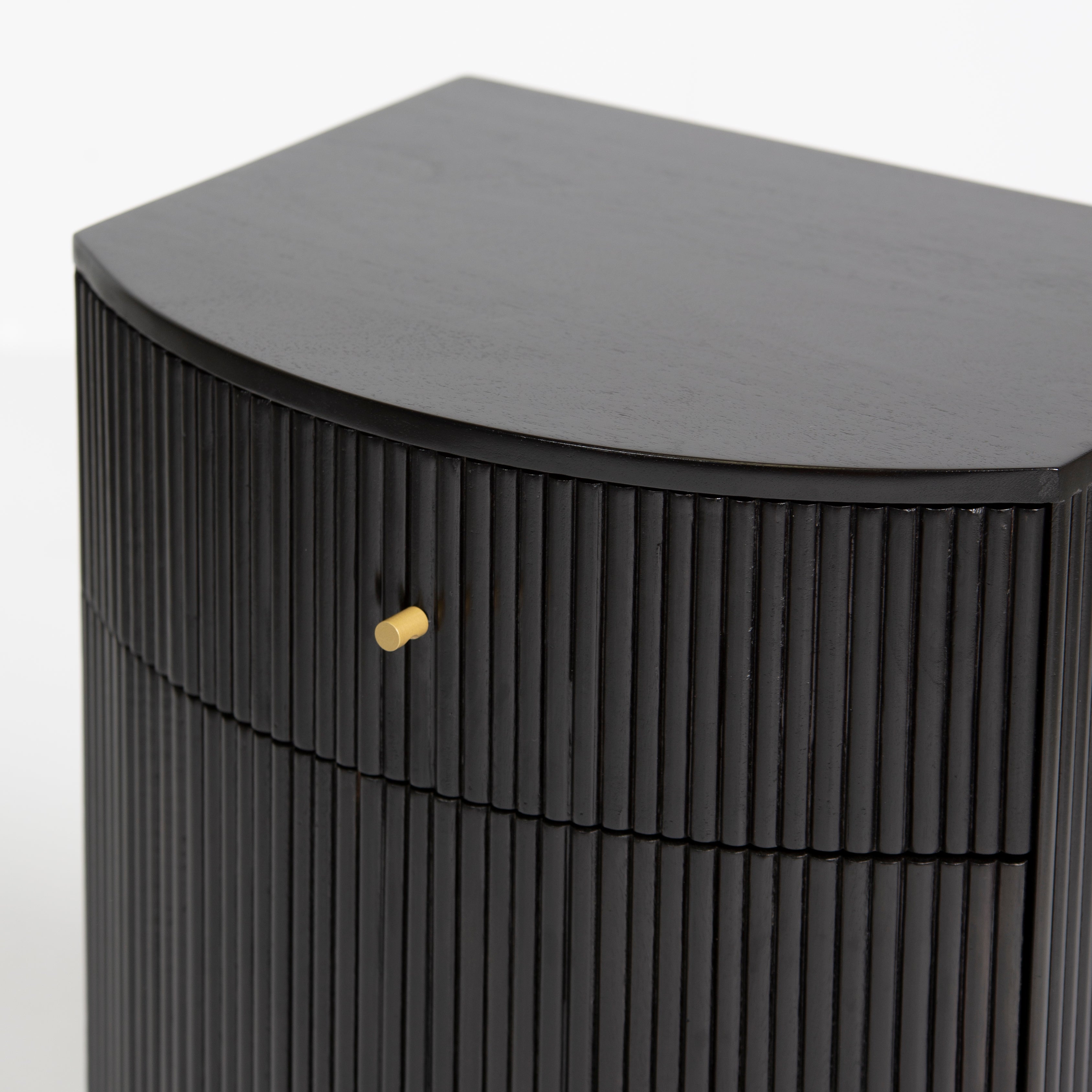 Wooden side drawer featuring fluted texture in black with brass accents, handcrafted furniture piece