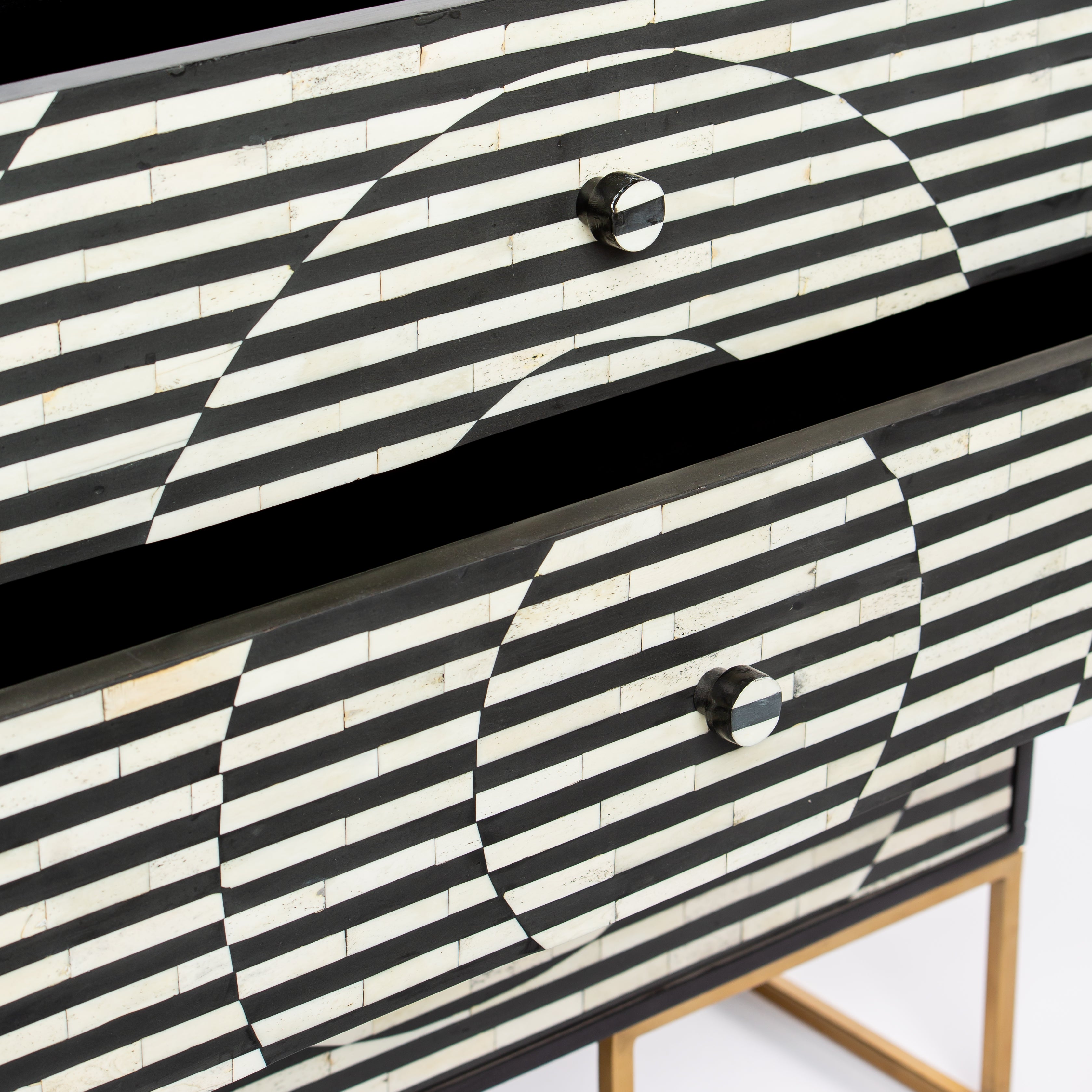 Black and white geometric bone inlay chest of drawers with gold base