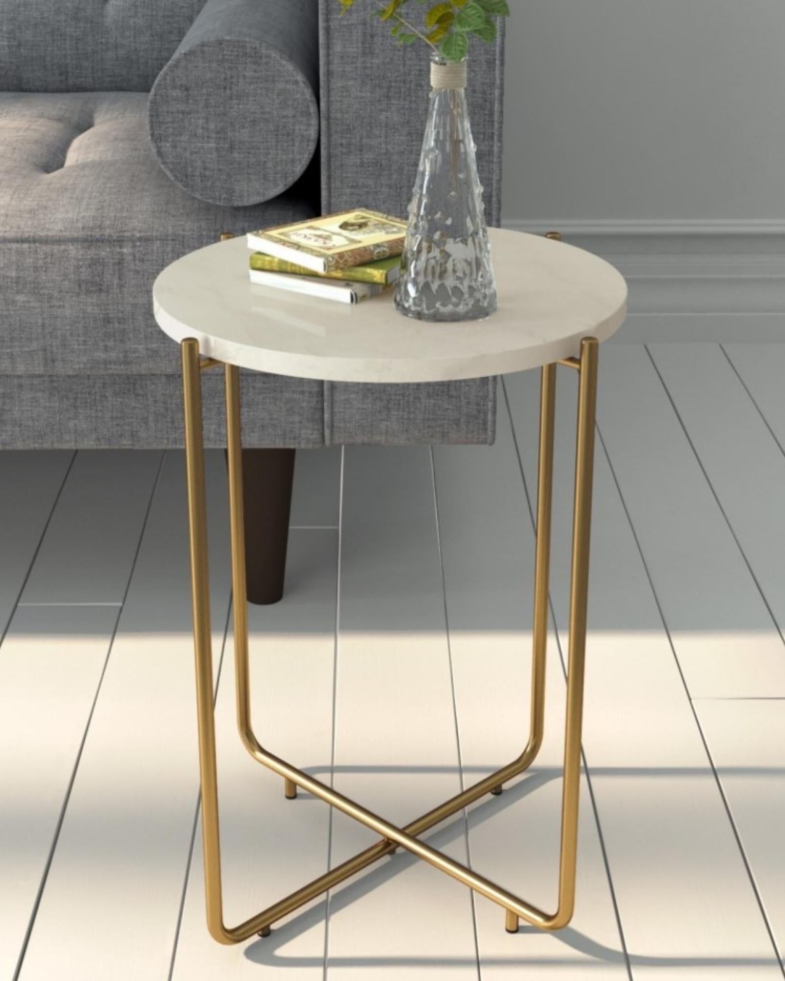 Marble side table featuring round white top with brass metal base, handcrafted furniture piece.