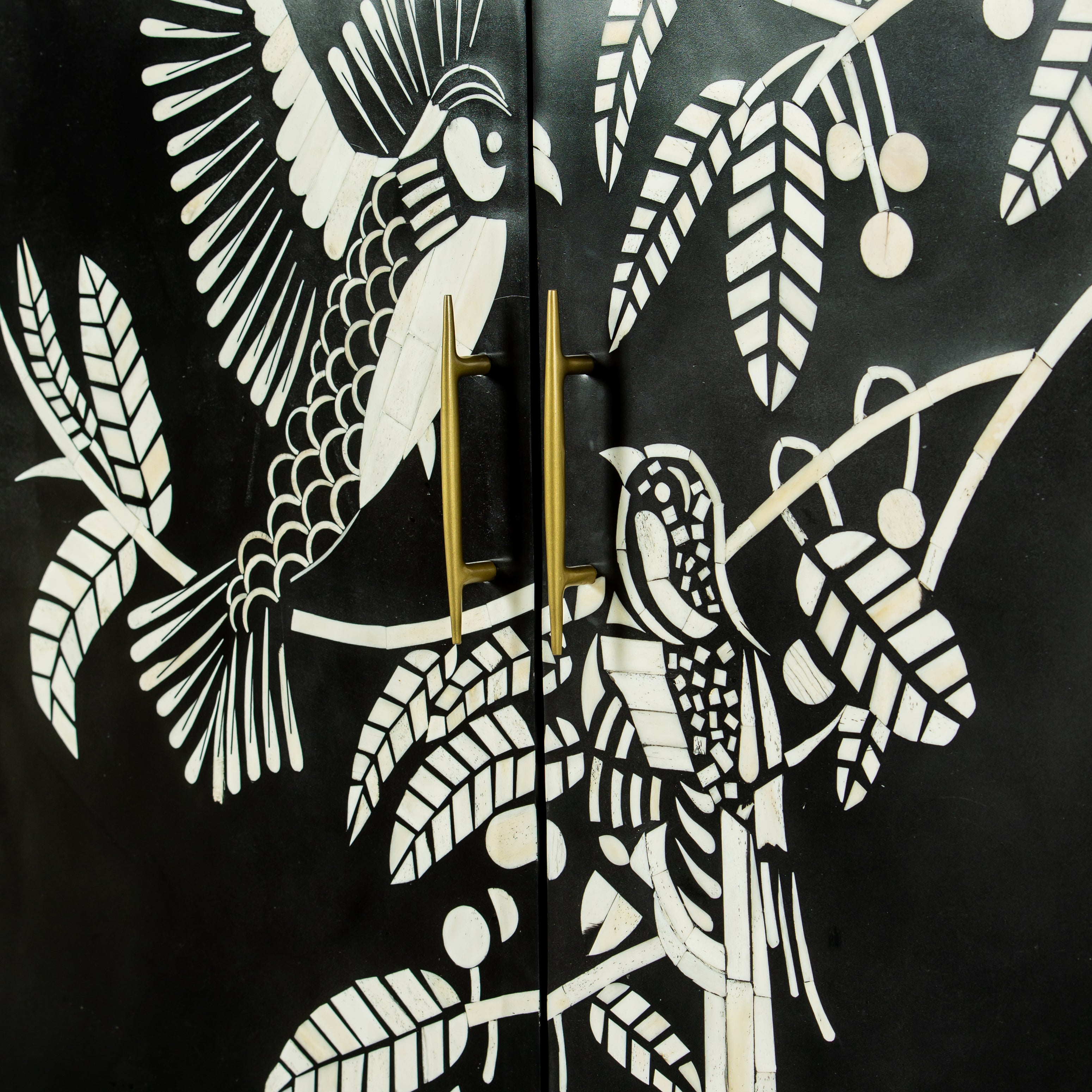 Handcrafted white bone inlay cabinet by Tabeer Homes, featuring bird and leaf motifs on mango wood with brass handles and global delivery.