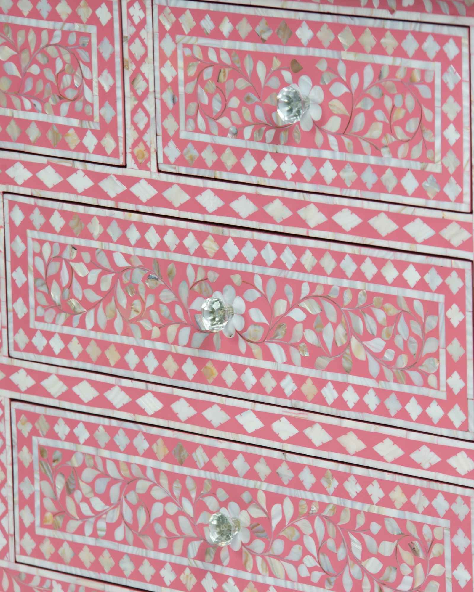 Mother of pearl inlay chest of drawers featuring intricate floral pattern in pink and white, handcrafted furniture piece