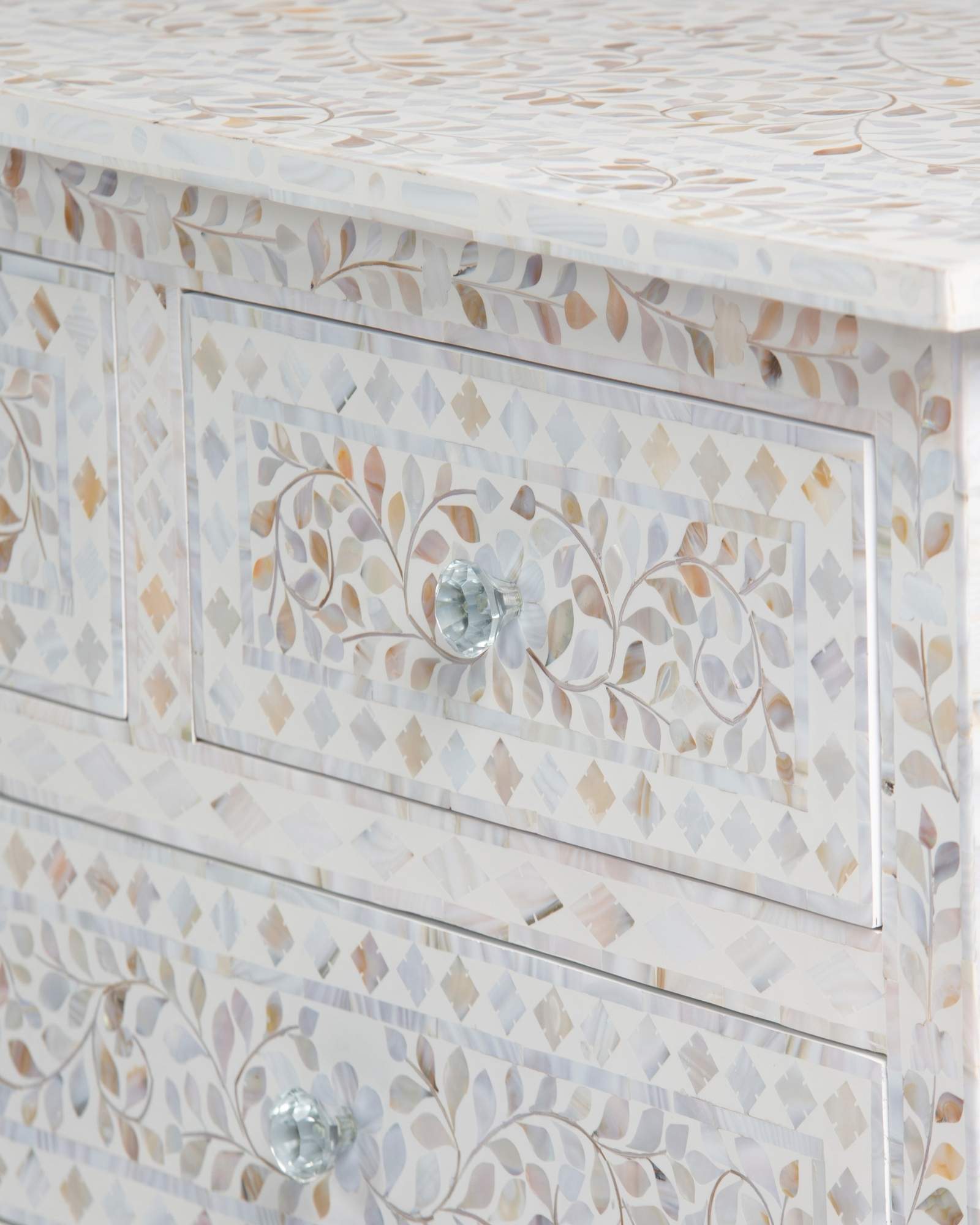 Mother of pearl inlay chest of drawers featuring intricate floral pattern in white and multitone, handcrafted furniture piece.