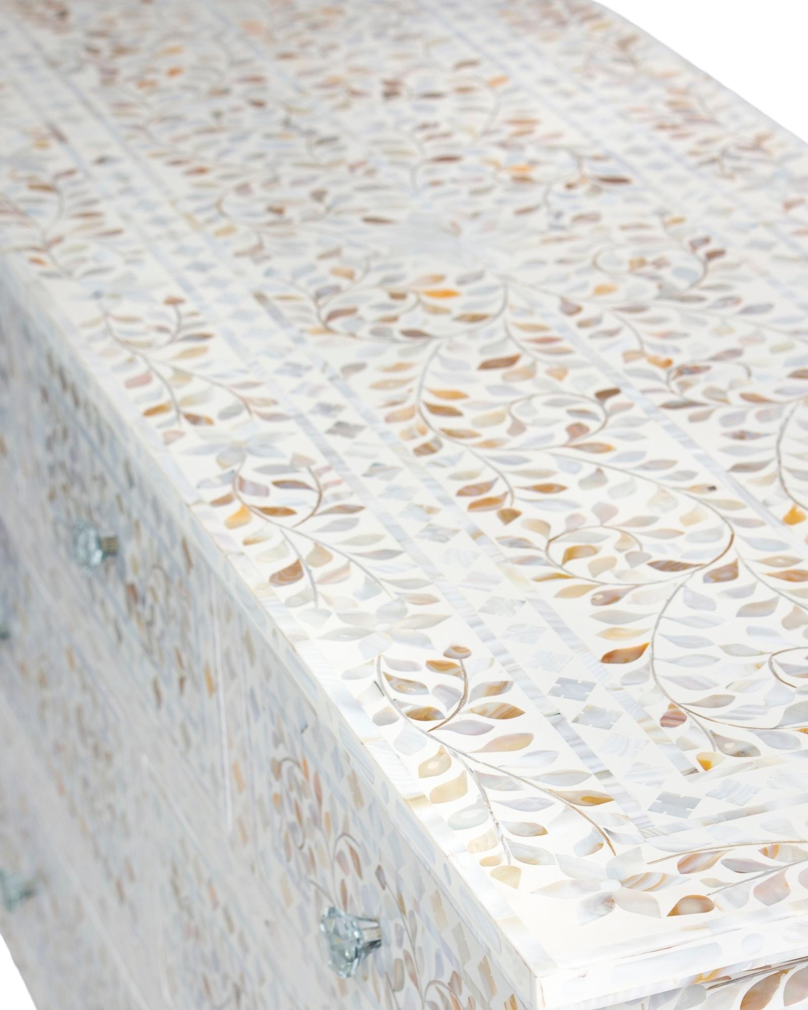 Mother of pearl inlay chest of drawers featuring intricate floral pattern in white and multitone, handcrafted furniture piece.