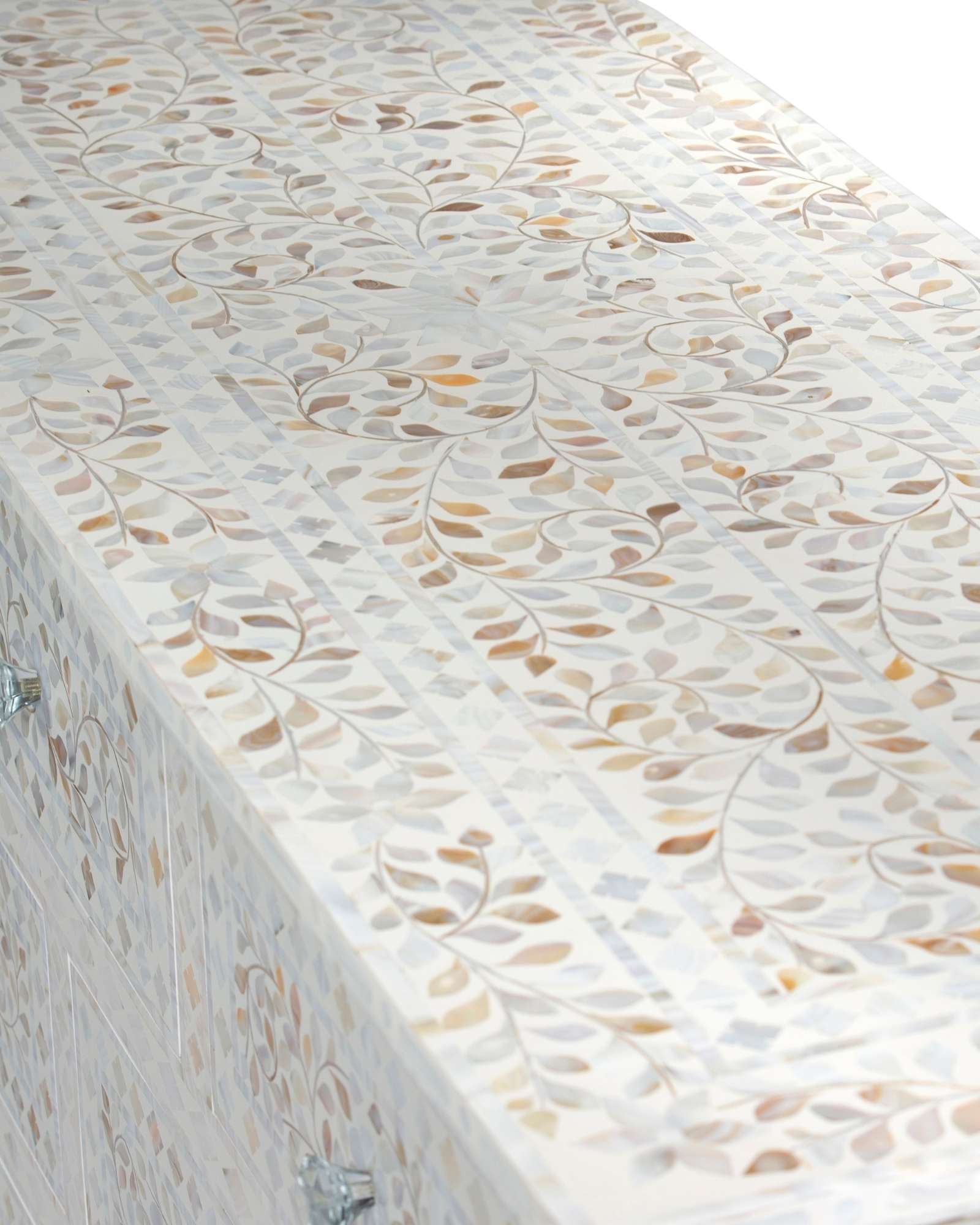 Mother of pearl inlay chest of drawers featuring intricate floral pattern in white and multitone, handcrafted furniture piece.