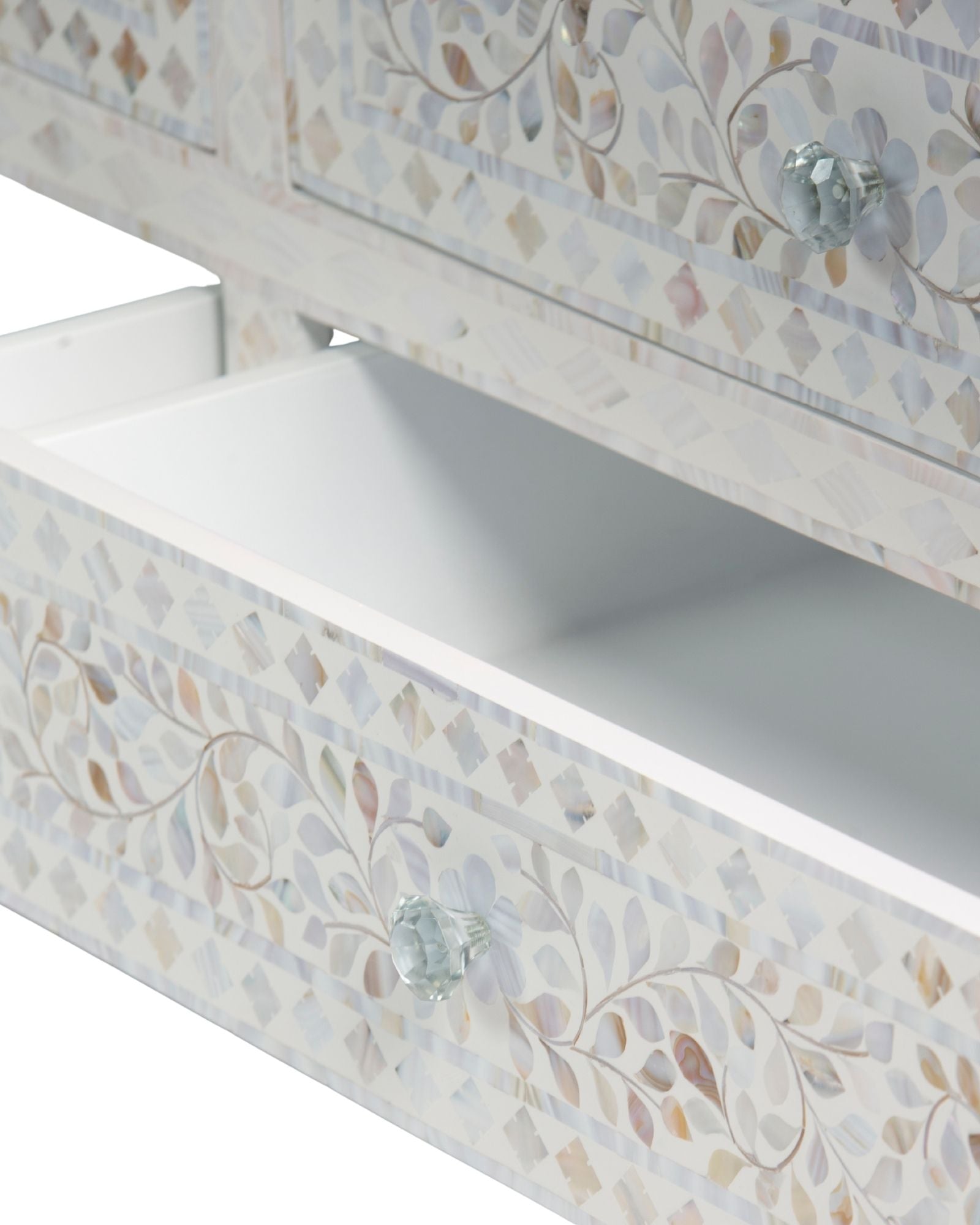 Mother of pearl inlay chest of drawers featuring intricate floral pattern in white and multitone, handcrafted furniture piece.