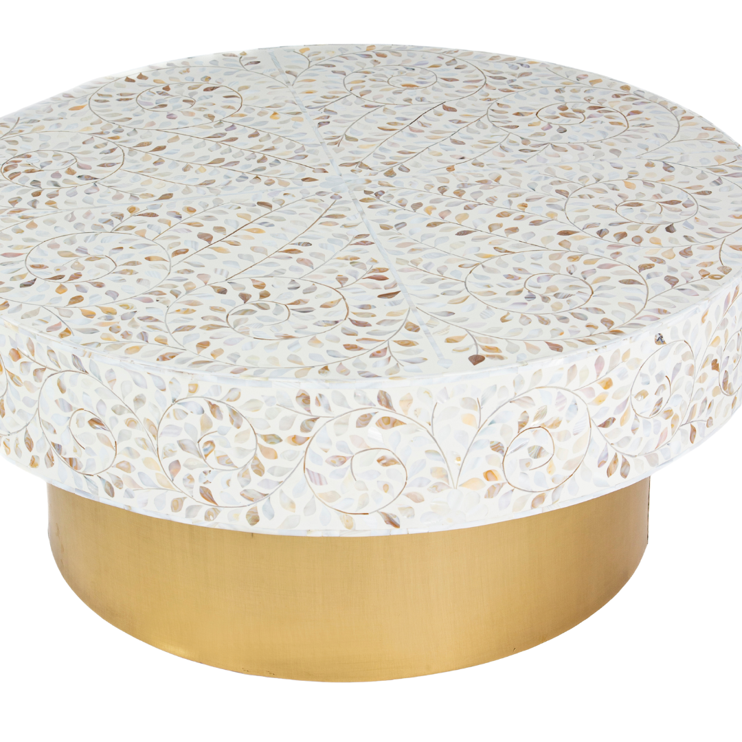 White mother of pearl inlay coffee table featuring intricate floral vine design and brushed gold cylindrical base by Tabeer Homes.