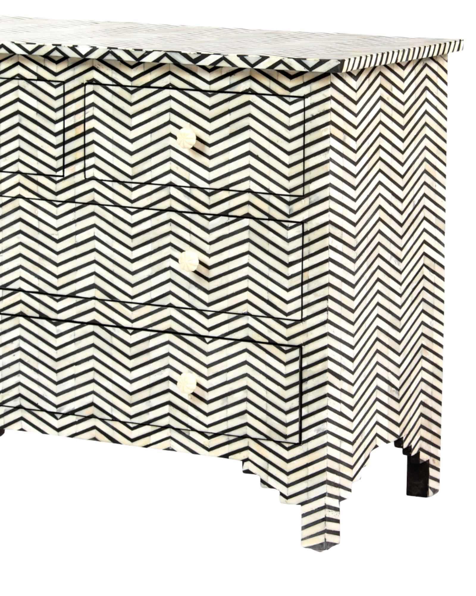 Featuring a Black Bone Inlay Chest of Drawer in chevron pattern, the Isra collection enhances your space with intricately handcrafted designs that elevate your home and living aesthetics.
