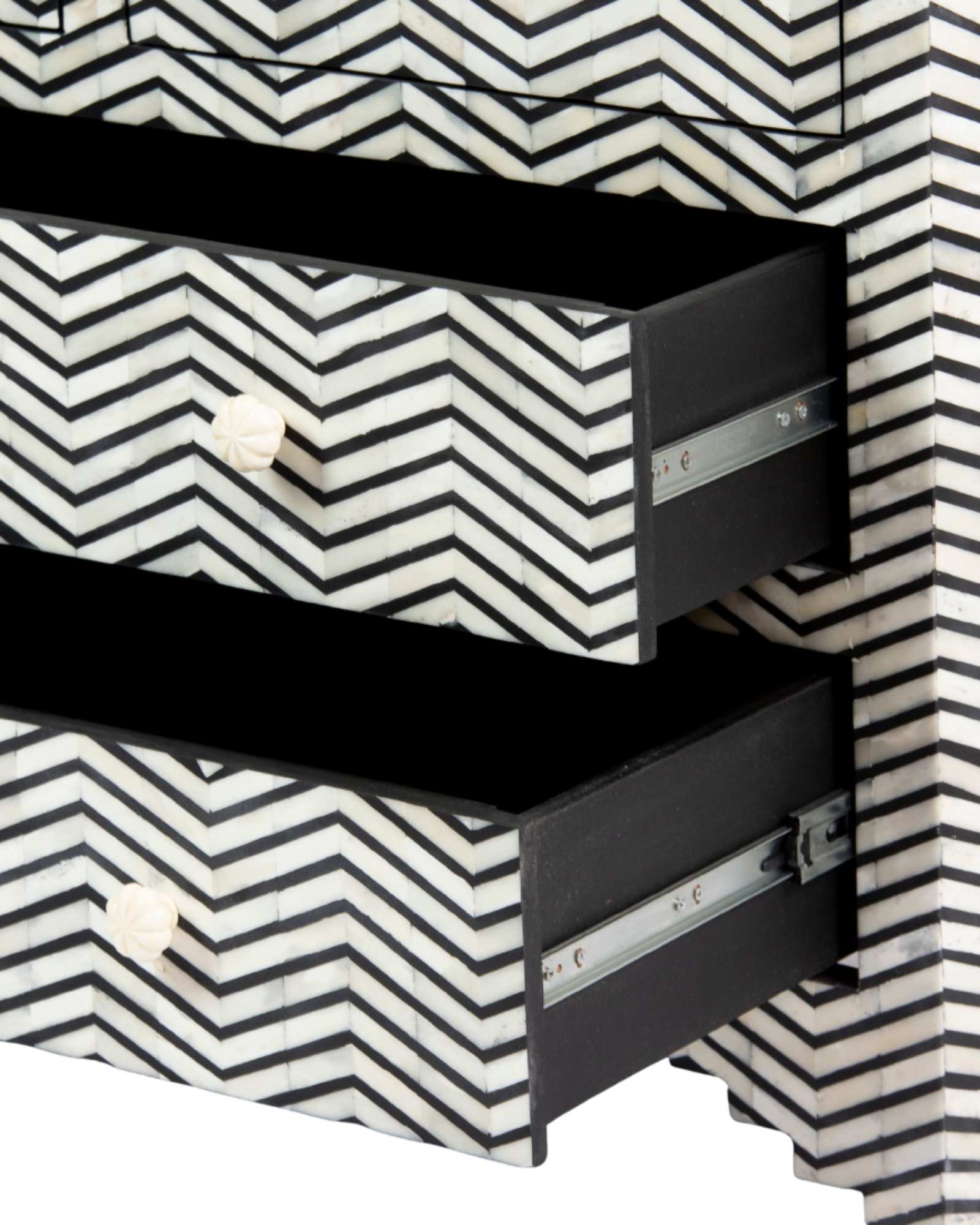 Featuring a Black Bone Inlay Chest of Drawer in chevron pattern, the Isra collection enhances your space with intricately handcrafted designs that elevate your home and living aesthetics.