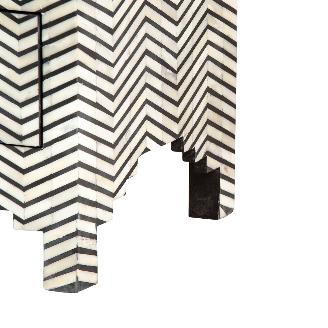 Featuring a Black Bone Inlay Chest of Drawer in chevron pattern, the Isra collection enhances your space with intricately handcrafted designs that elevate your home and living aesthetics.