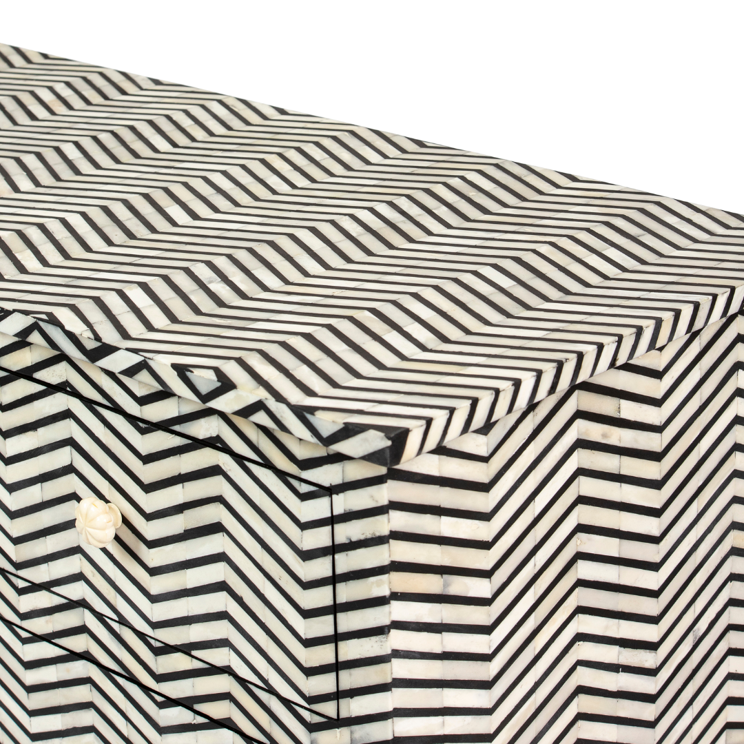 Featuring a Black Bone Inlay Chest of Drawer in chevron pattern, the Isra collection enhances your space with intricately handcrafted designs that elevate your home and living aesthetics.