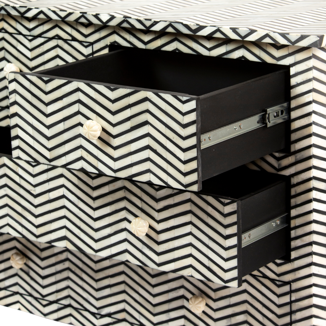 Featuring a Black Bone Inlay Chest of Drawer in chevron pattern, the Isra collection enhances your space with intricately handcrafted designs that elevate your home and living aesthetics.