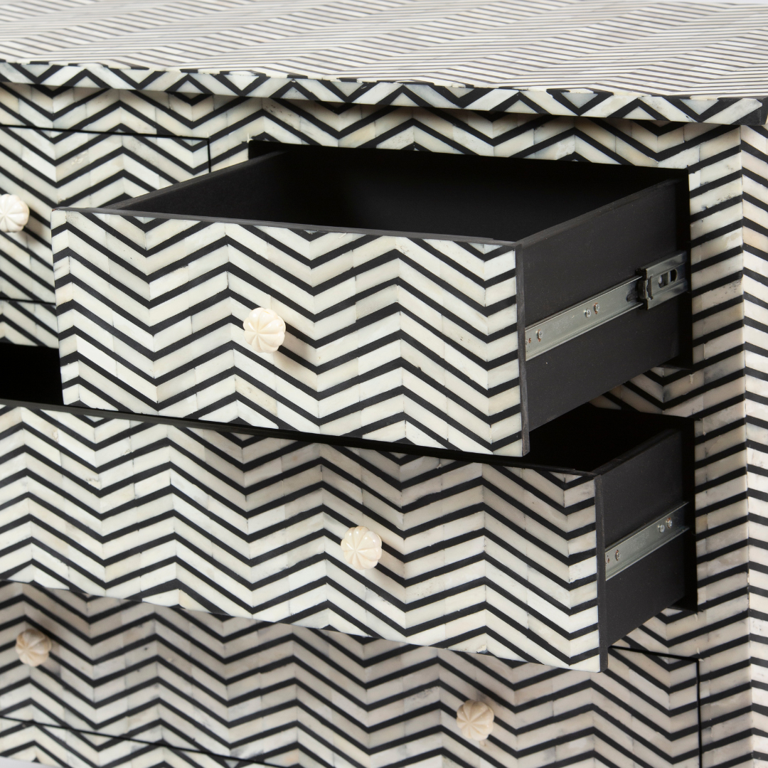 Featuring a Black Bone Inlay Chest of Drawer in chevron pattern, the Isra collection enhances your space with intricately handcrafted designs that elevate your home and living aesthetics.