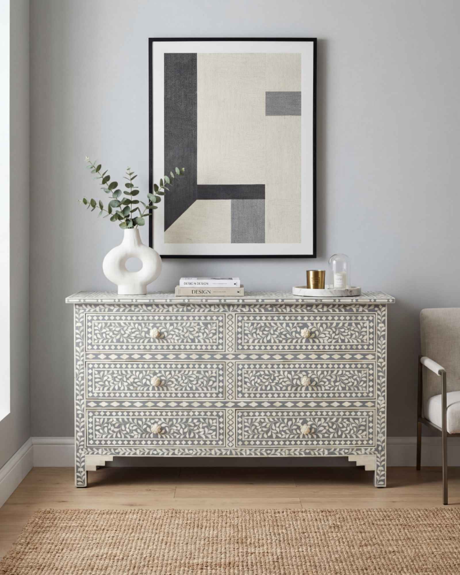 Bone inlay chest of drawers featuring intricate floral pattern in grey and white, handcrafted furniture piece.