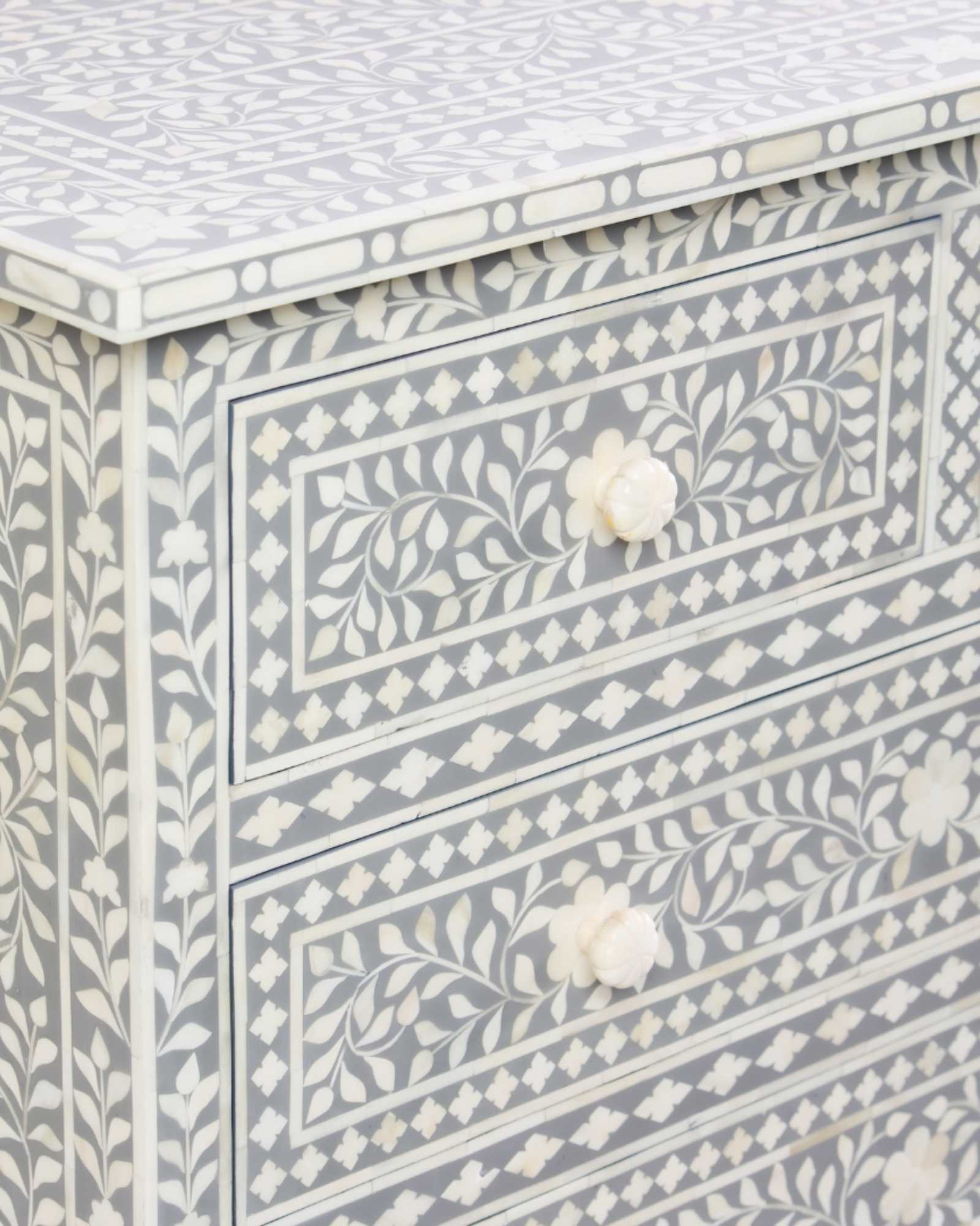 Featuring a Grey Bone Inlay Chest of Drawer in floral pattern, the Jade collection enhances your space with intricately handcrafted designs that elevate your home and living aesthetics.
