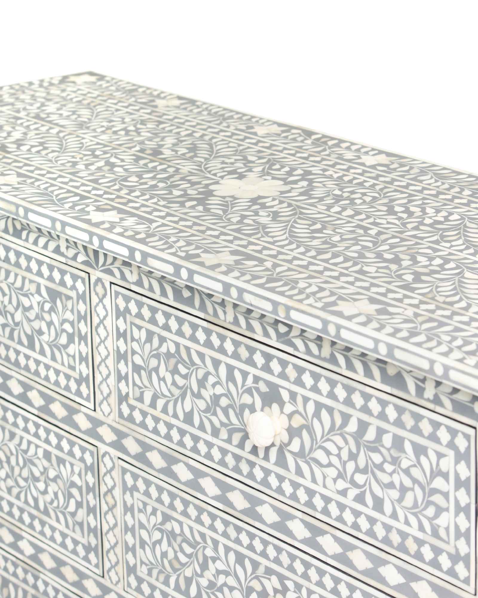 Bone inlay chest of drawers featuring intricate floral pattern in grey and white, handcrafted furniture piece.