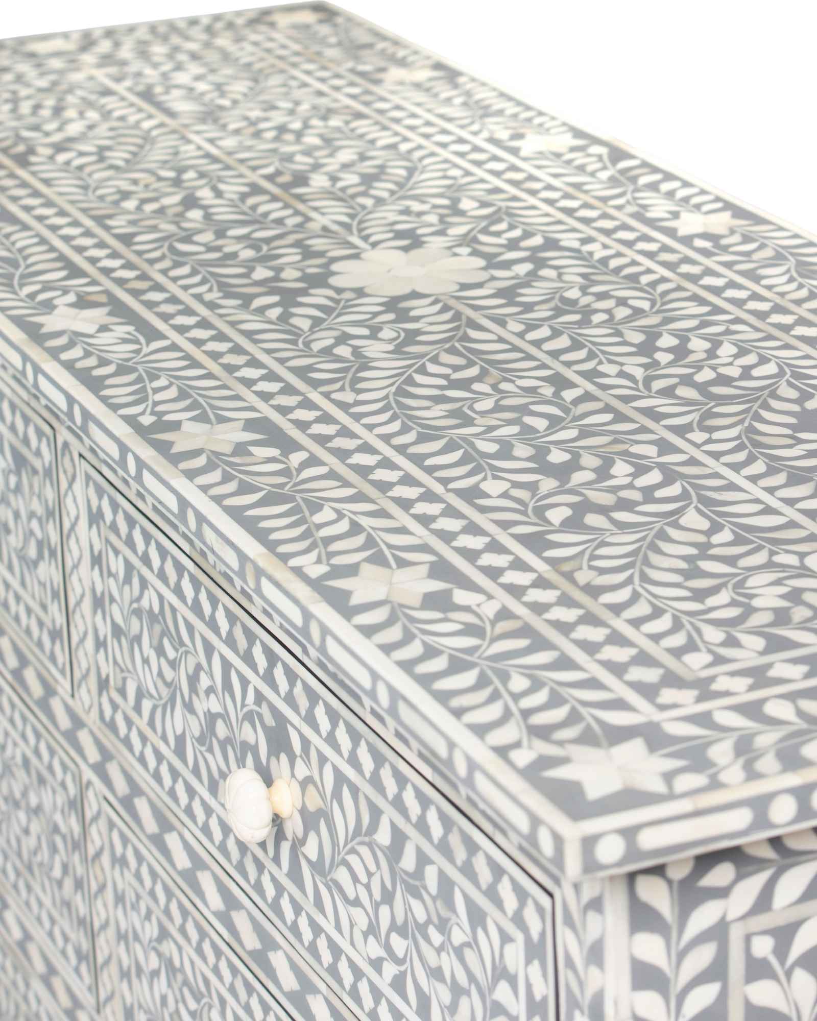Bone inlay chest of drawers featuring intricate floral pattern in grey and white, handcrafted furniture piece.