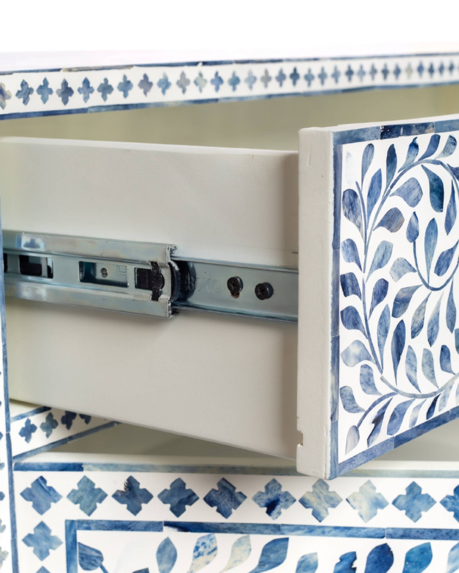 Featuring a beautiful floral sideboard in Dyed Blue Bone Inlay with intricate hand inlaid work. Part of the Jade Collection - this buffet can be used as at an entryway or as a cutlery storage unit.