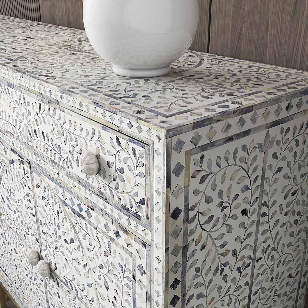 Featuring a beautiful floral sideboard in Dyed Blue Bone Inlay with intricate hand inlaid work. Part of the Jade Collection - this buffet can be used as at an entryway or as a cutlery storage unit.