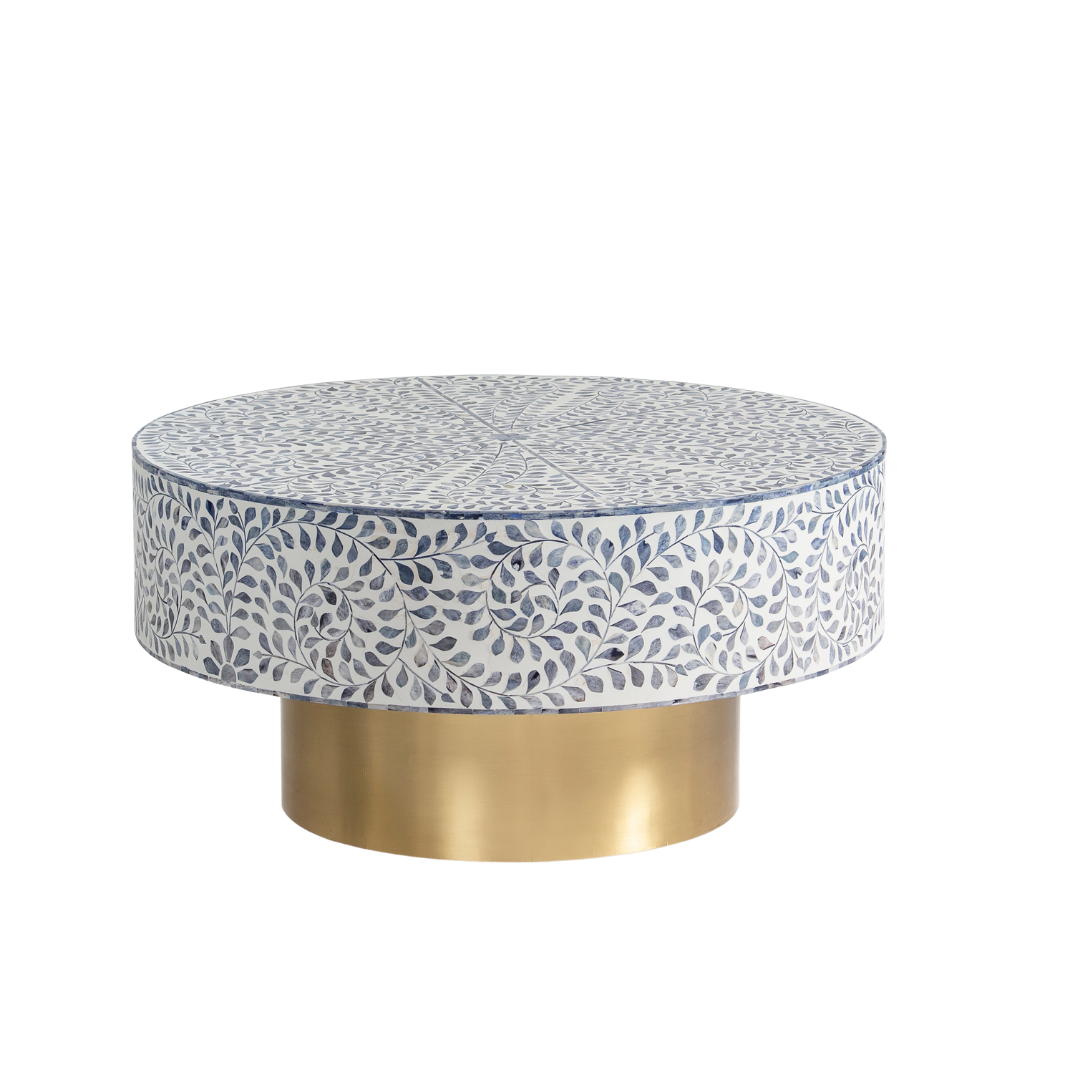 Handcrafted Jade coffee table featuring intricate blue bone inlay detailing with a round silhouette and brushed brass base.