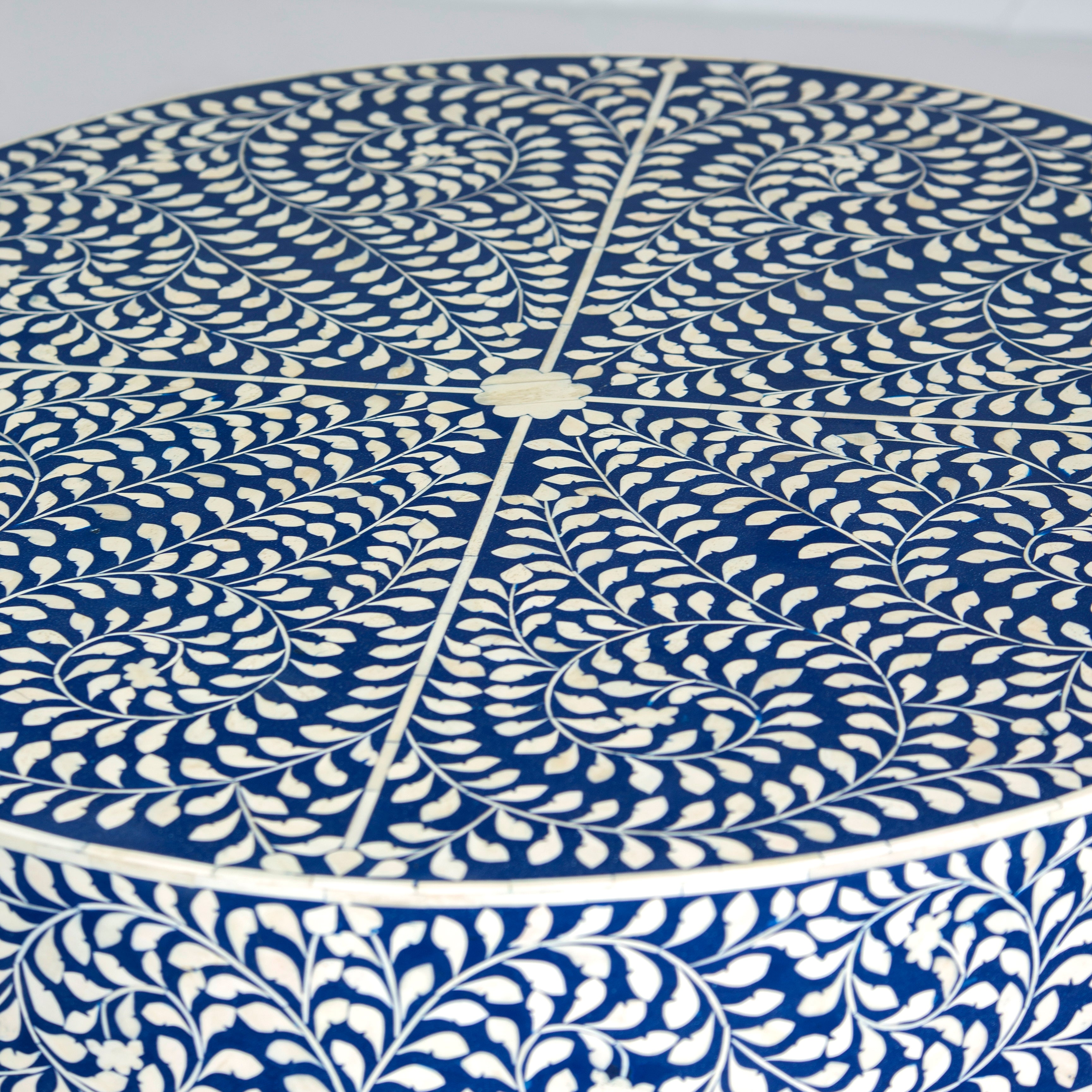 Bone inlay coffee table featuring intricate floral vine pattern in blue and white, handcrafted furniture piece