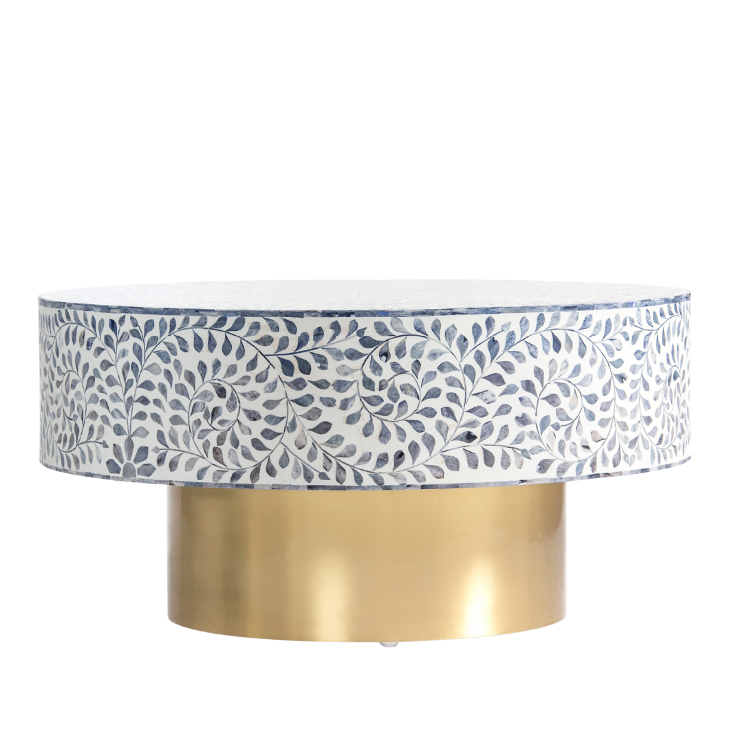 Handcrafted Jade coffee table featuring intricate blue bone inlay detailing with a round silhouette and brushed brass base.