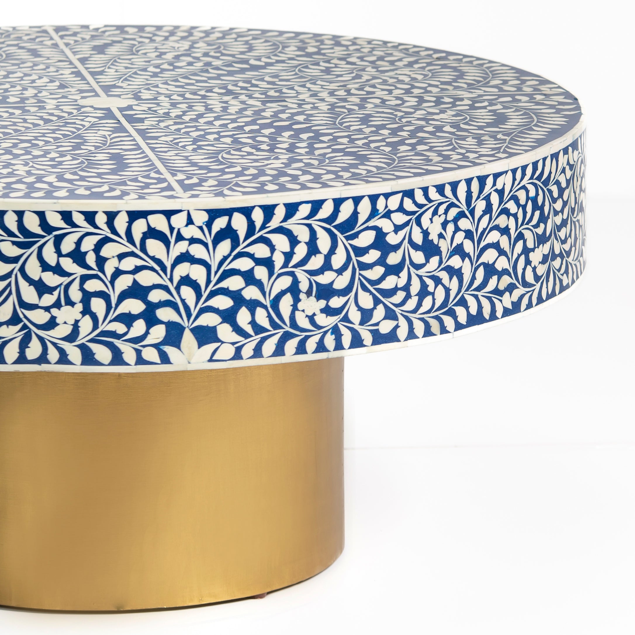 Bone inlay coffee table featuring intricate floral vine pattern in blue and white, handcrafted furniture piece