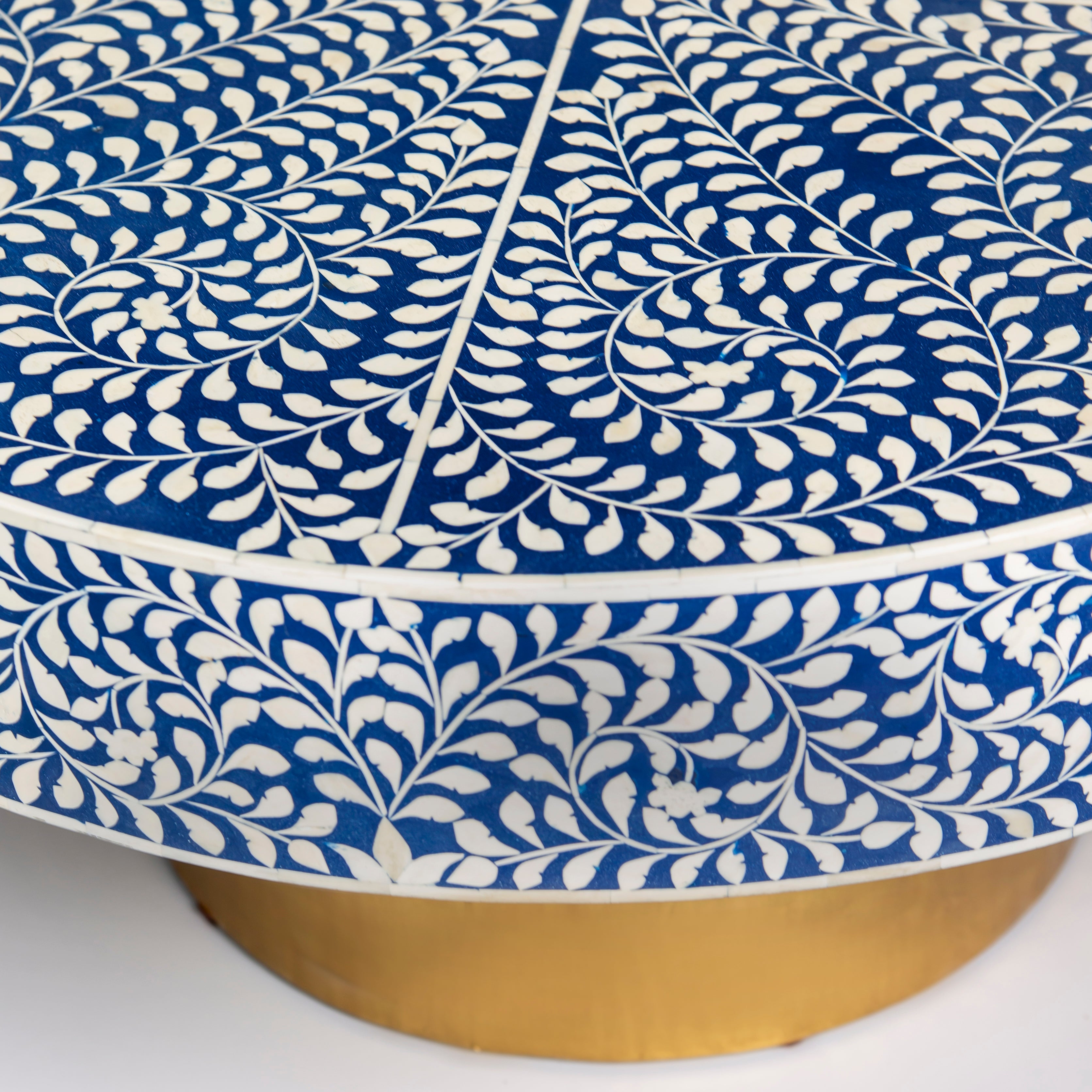 Bone inlay coffee table featuring intricate floral vine pattern in blue and white, handcrafted furniture piece