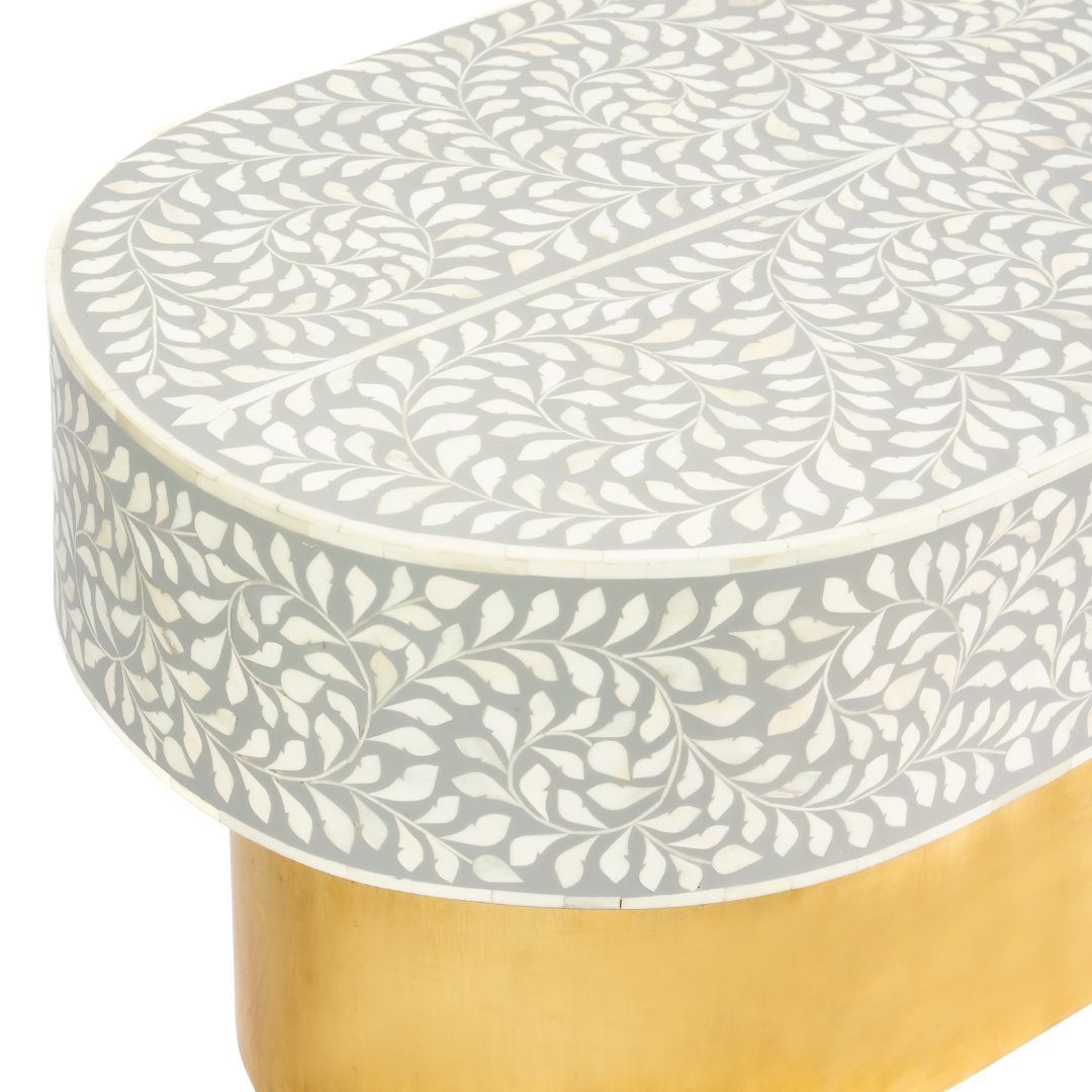 Elegant grey bone inlay coffee table with a gold base. Compact, handcrafted and eye-catching – a timeless addition to your space.