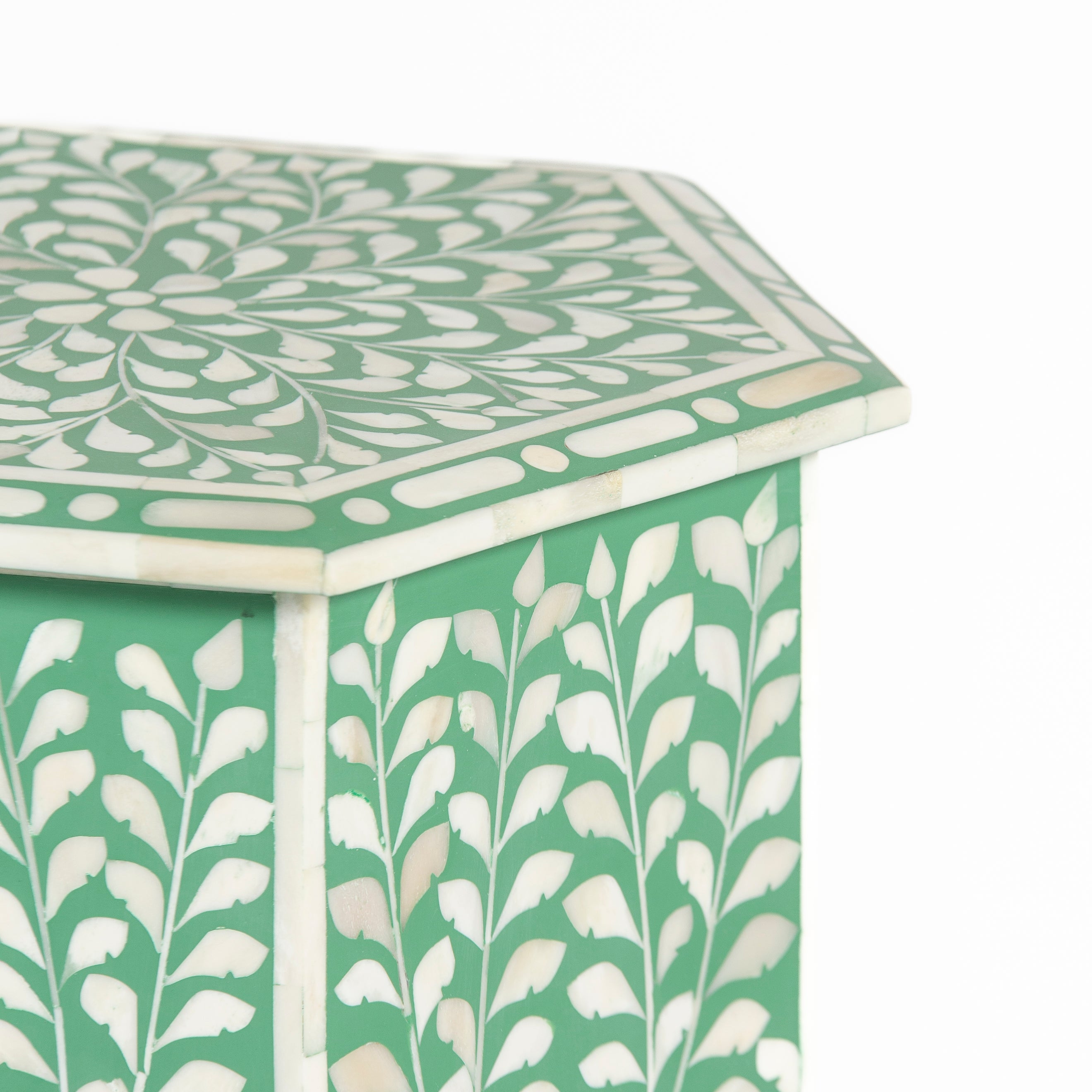 Handcrafted Jade side table featuring green bone inlay with a hexagonal silhouette, floral detailing, and arched legs.