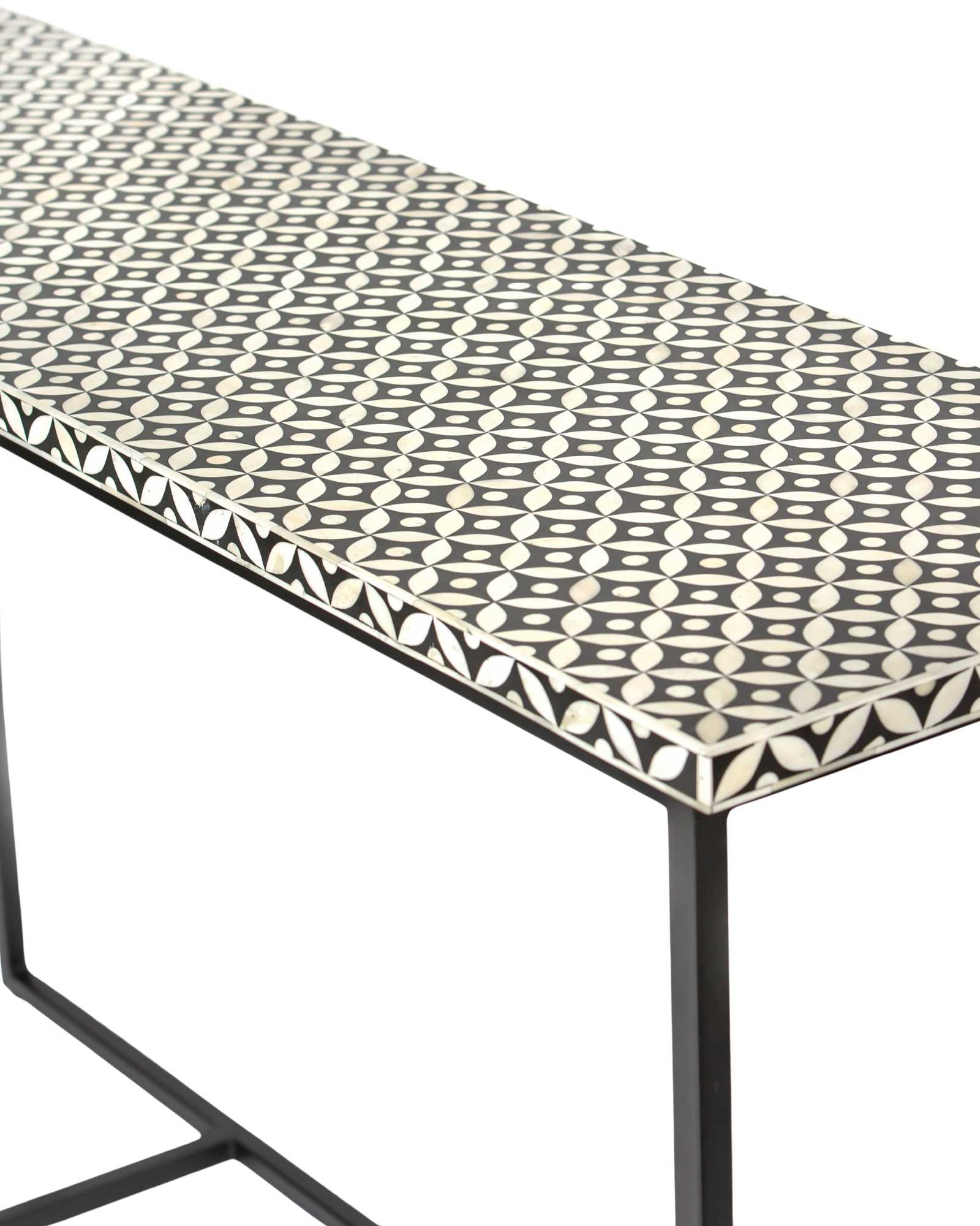 Bone inlay console table featuring geometric pattern in black and white with metal base, handcrafted furniture piece.