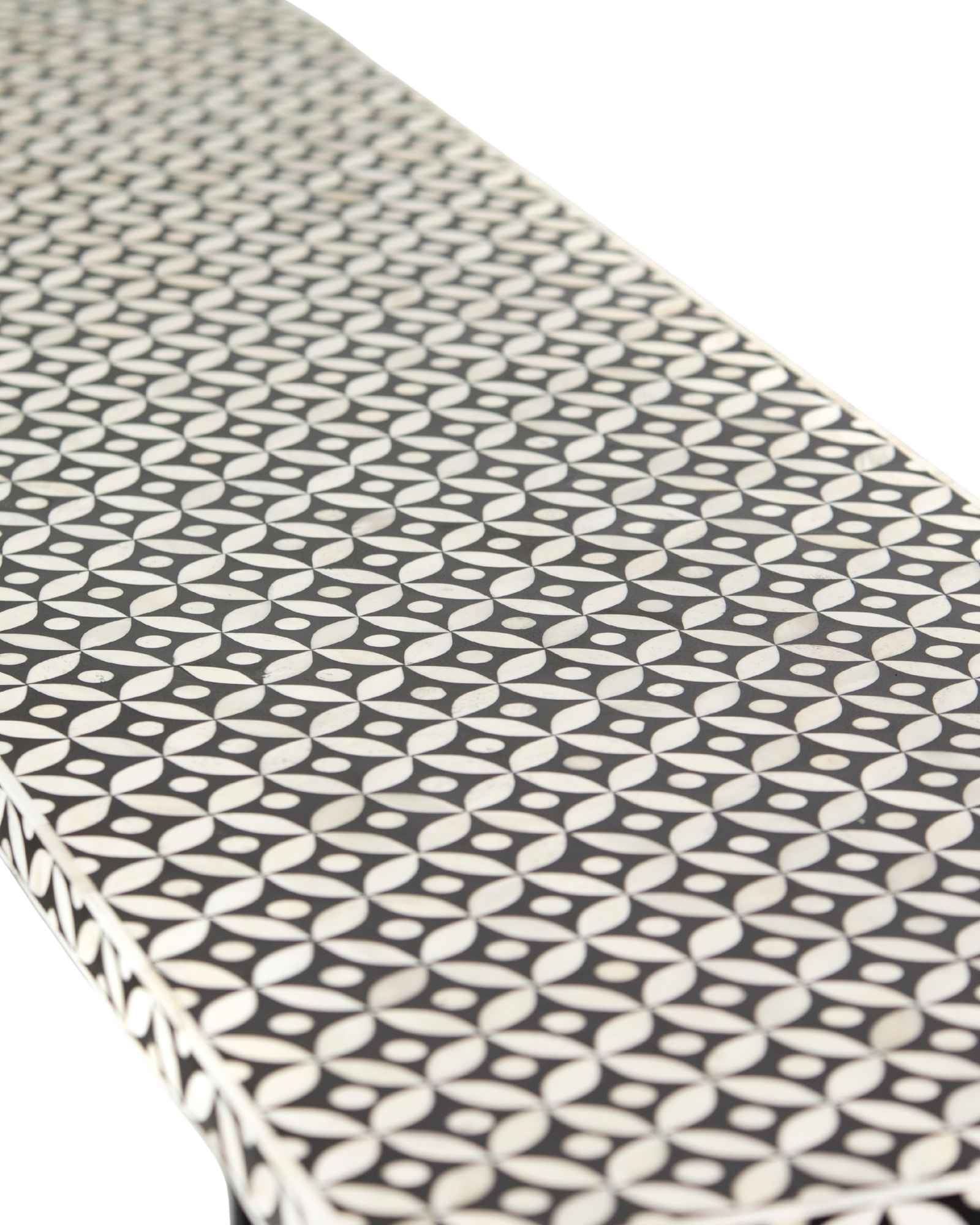 Bone inlay console table featuring geometric pattern in black and white with metal base, handcrafted furniture piece.