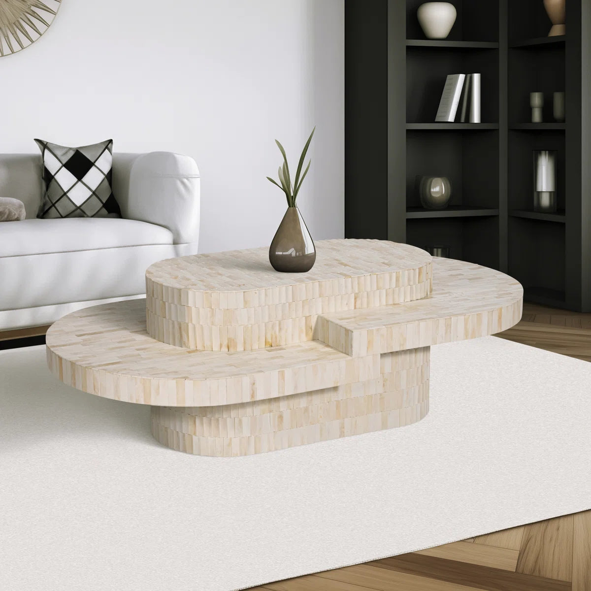 Sculptural bone carved coffee table with layered design in soft neutral tones, handcrafted with curved tiers and textured artisanal detailing.