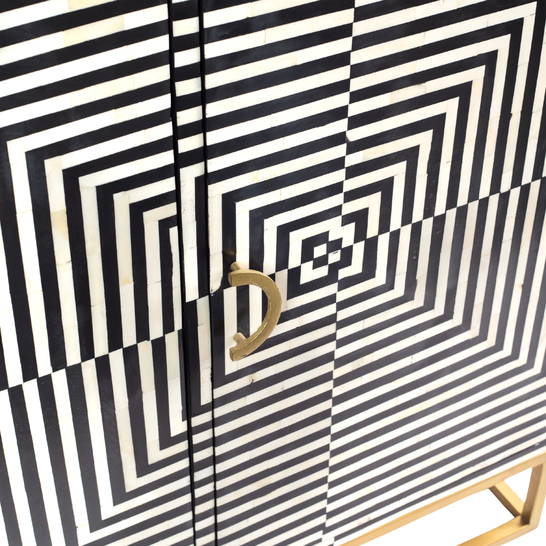 Black & White bone inlay cabinet in striped vine pattern, brass legs, and brass handles, handcrafted with spacious storage and artisanal charm.