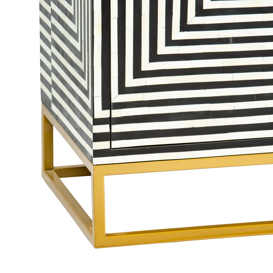 Black & White bone inlay cabinet in striped vine pattern, brass legs, and brass handles, handcrafted with spacious storage and artisanal charm.
