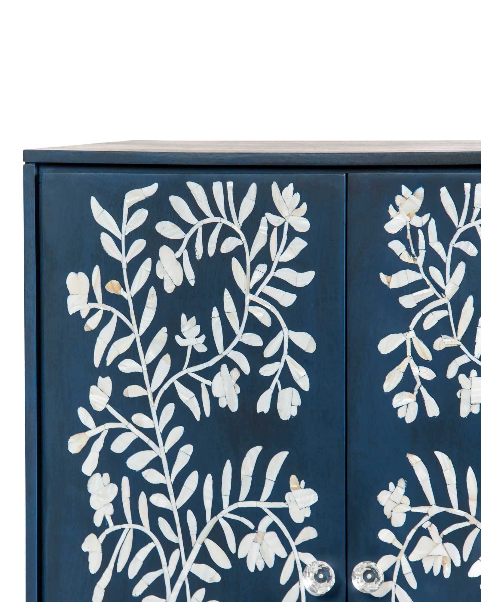 Mother of pearl inlay cabinet featuring intricate floral vine pattern in blue and white, handcrafted furniture piece.