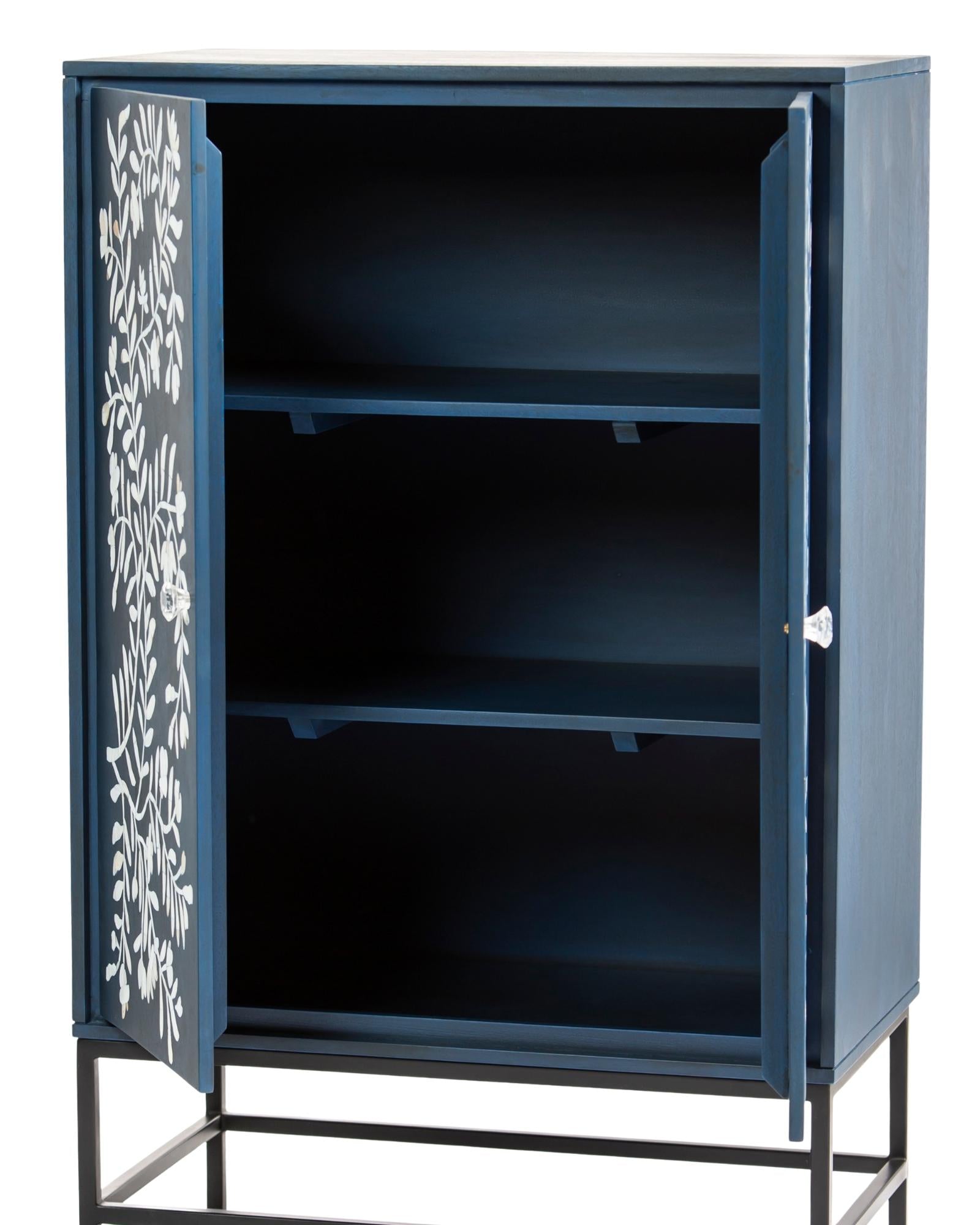 Mother of pearl inlay cabinet featuring intricate floral vine pattern in blue and white, handcrafted furniture piece.