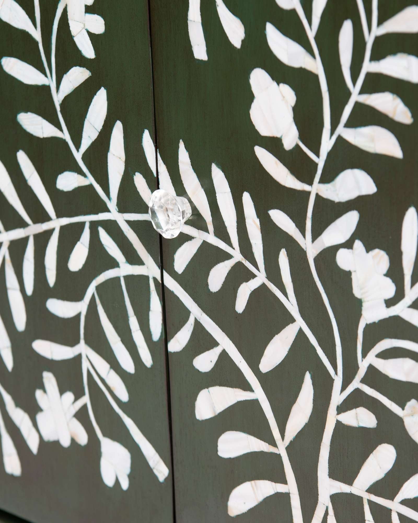 Mother of pearl inlay cabinet featuring intricate floral vine pattern in green and white, handcrafted furniture piece.