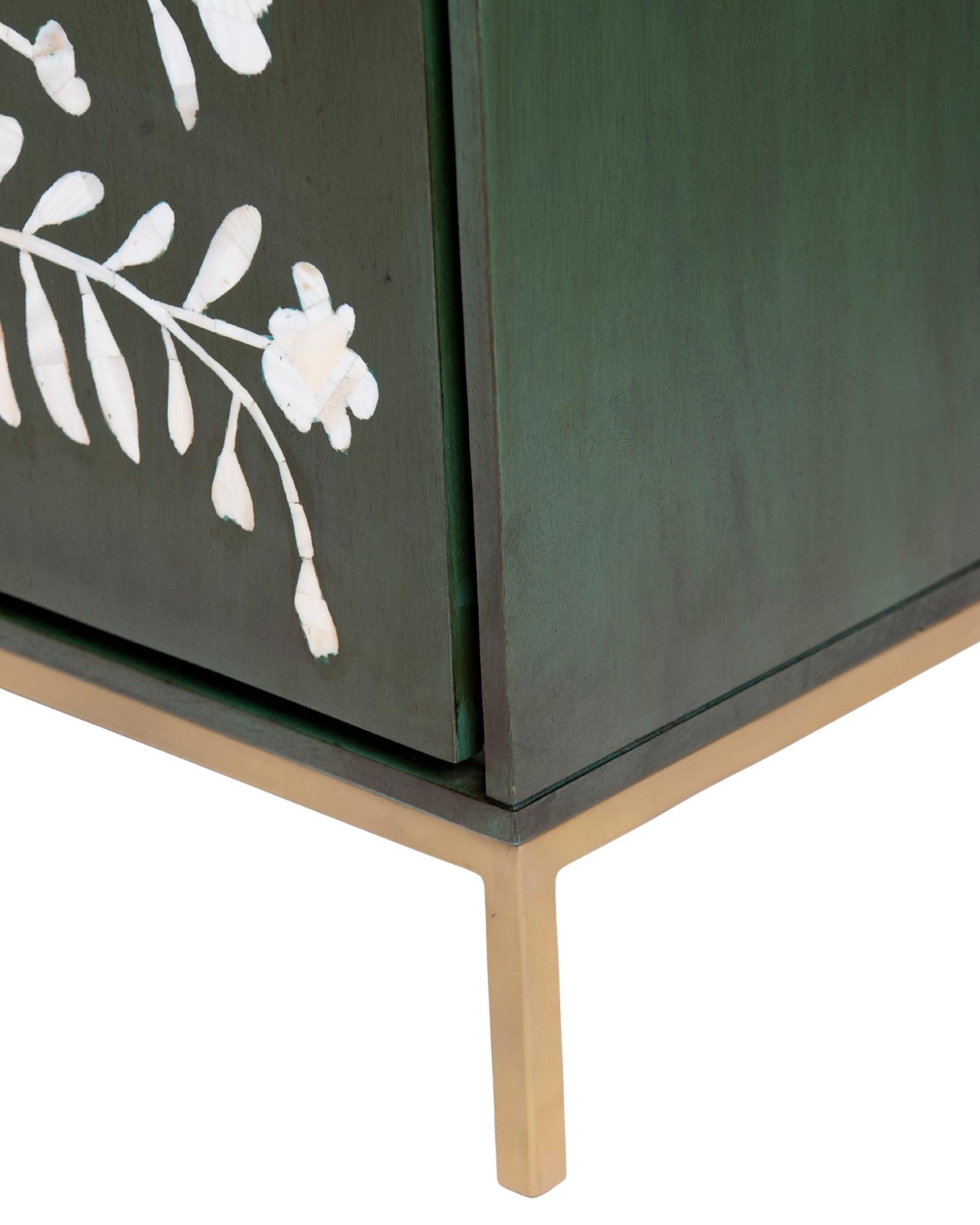 Mother of pearl inlay cabinet featuring intricate floral vine pattern in green and white, handcrafted furniture piece.